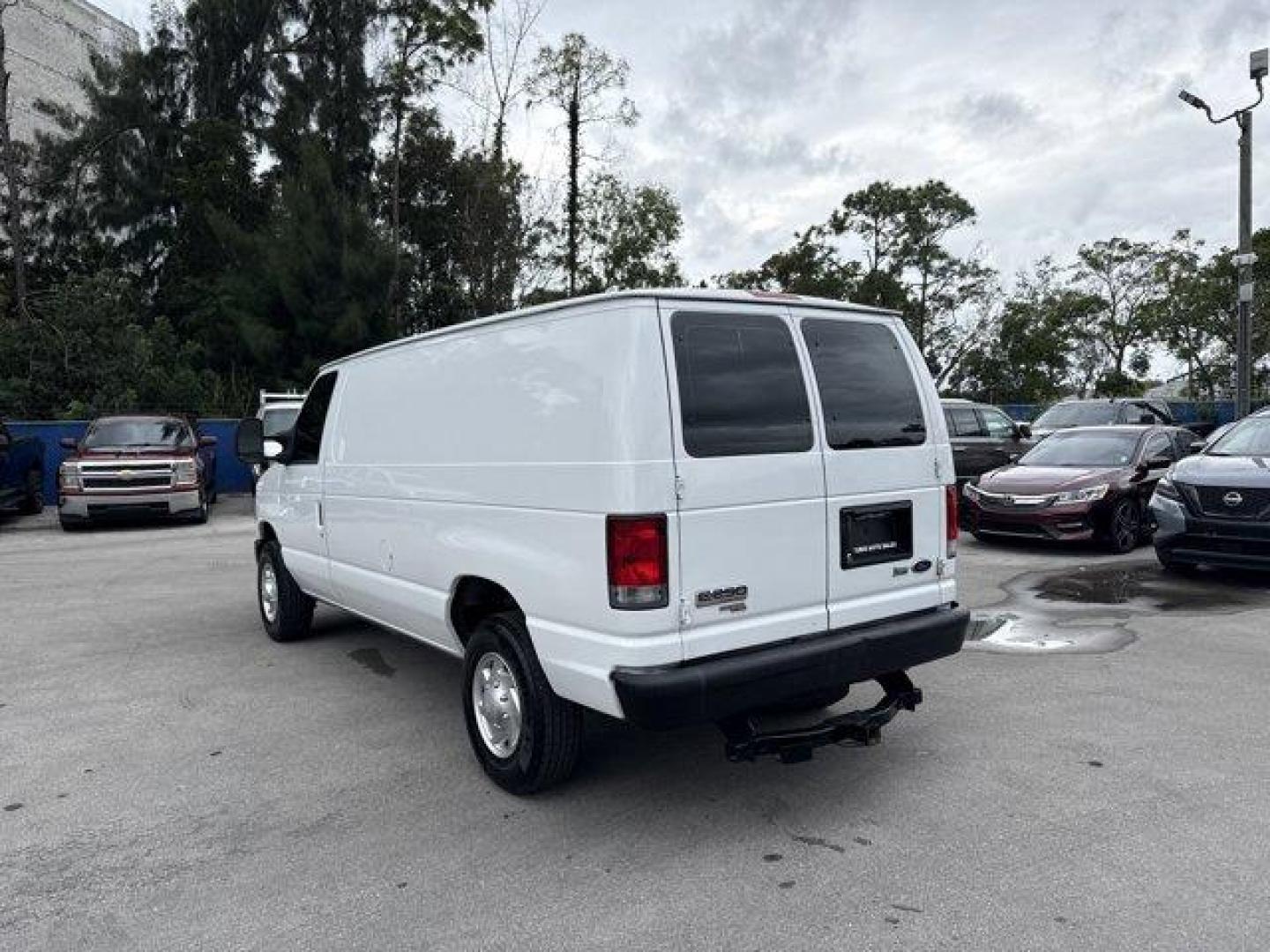 2014 White Ford Econoline Cargo Van (1FTNE2EW9ED) with an 8 4.6 L engine, Automatic transmission, located at 27610 S Dixie Hwy, Homestead, FL, 33032, (305) 749-2348, 25.510241, -80.438301 - KBB.com Brand Image Awards. Only 129,906 Miles! Delivers 16 Highway MPG and 13 City MPG! This Ford Econoline Cargo Van delivers a Regular Unleaded V-8 4.6 L/281 engine powering this Automatic transmission. Wheels: 16 x 7 Steel, Variable Intermittent Wipers, Urethane Gear Shifter Material.*This Ford - Photo#2