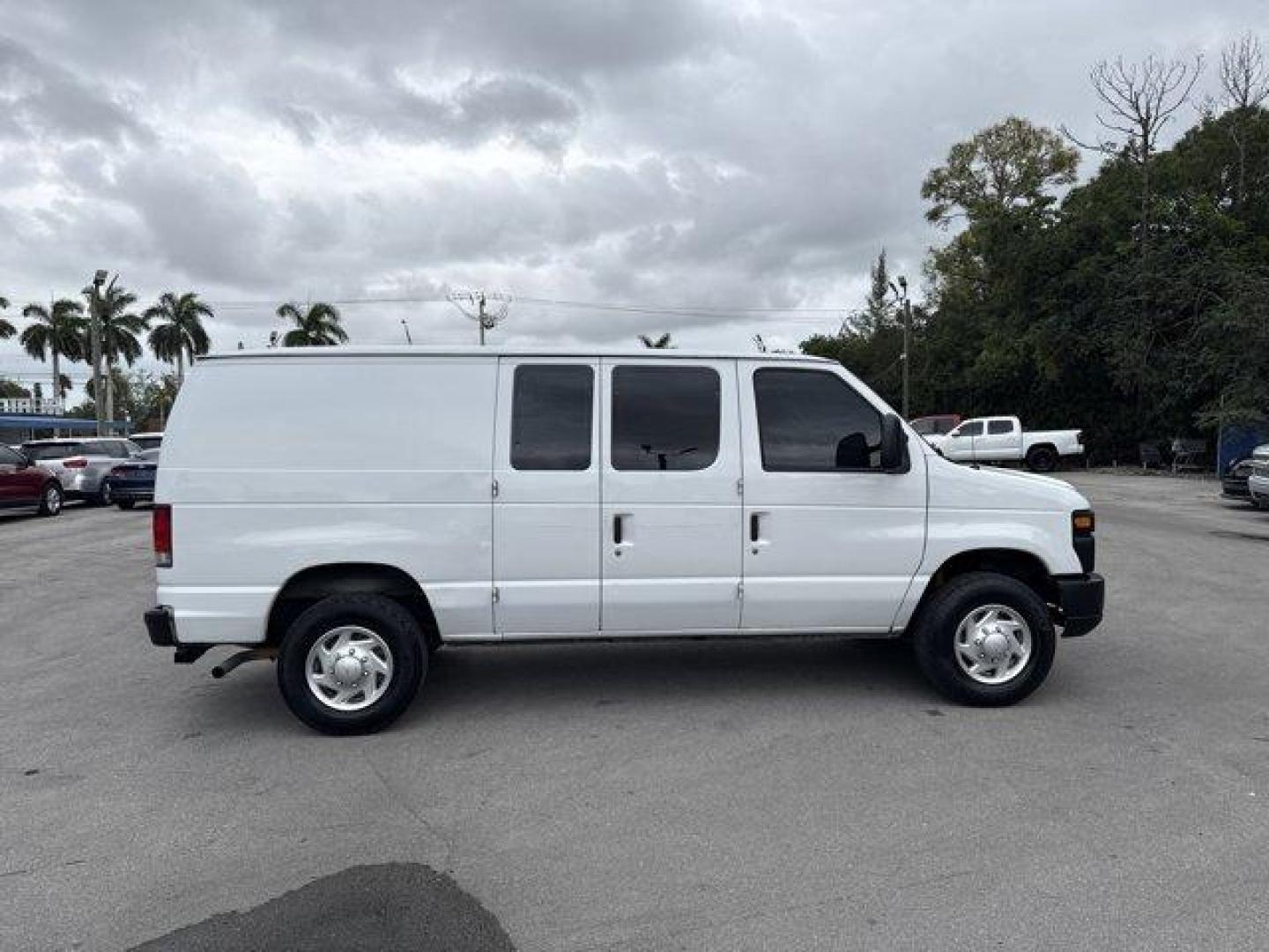 2014 White Ford Econoline Cargo Van (1FTNE2EW9ED) with an 8 4.6 L engine, Automatic transmission, located at 27610 S Dixie Hwy, Homestead, FL, 33032, (305) 749-2348, 25.510241, -80.438301 - KBB.com Brand Image Awards. Only 129,906 Miles! Delivers 16 Highway MPG and 13 City MPG! This Ford Econoline Cargo Van delivers a Regular Unleaded V-8 4.6 L/281 engine powering this Automatic transmission. Wheels: 16 x 7 Steel, Variable Intermittent Wipers, Urethane Gear Shifter Material.*This Ford - Photo#5