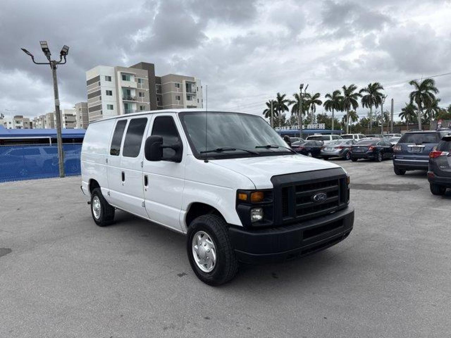 2014 White Ford Econoline Cargo Van (1FTNE2EW9ED) with an 8 4.6 L engine, Automatic transmission, located at 27610 S Dixie Hwy, Homestead, FL, 33032, (305) 749-2348, 25.510241, -80.438301 - KBB.com Brand Image Awards. Only 129,906 Miles! Delivers 16 Highway MPG and 13 City MPG! This Ford Econoline Cargo Van delivers a Regular Unleaded V-8 4.6 L/281 engine powering this Automatic transmission. Wheels: 16 x 7 Steel, Variable Intermittent Wipers, Urethane Gear Shifter Material.*This Ford - Photo#6