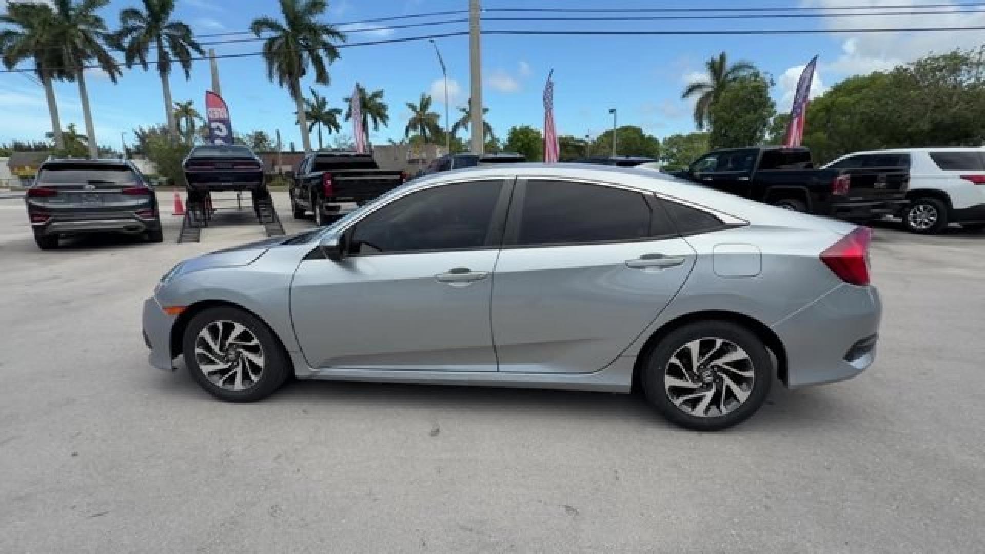 2018 Silver Honda Civic Sedan (2HGFC2F83JH) with an 4 2.0 L engine, Variable transmission, located at 27610 S Dixie Hwy, Homestead, FL, 33032, (305) 749-2348, 25.510241, -80.438301 - KBB.com 10 Most Awarded Brands. Scores 40 Highway MPG and 31 City MPG! This Honda Civic Sedan boasts a Regular Unleaded I-4 2.0 L/122 engine powering this Variable transmission. Wireless Phone Connectivity, Window Grid Antenna, Wheels: 16 Alloy.* This Honda Civic Sedan Features the Following Options- Photo#1