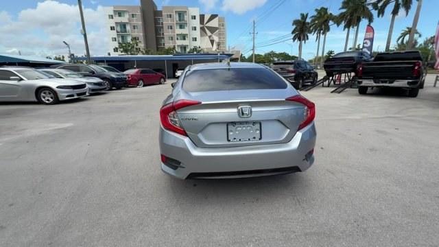 2018 Silver Honda Civic Sedan (2HGFC2F83JH) with an 4 2.0 L engine, Variable transmission, located at 27610 S Dixie Hwy, Homestead, FL, 33032, (305) 749-2348, 25.510241, -80.438301 - KBB.com 10 Most Awarded Brands. Scores 40 Highway MPG and 31 City MPG! This Honda Civic Sedan boasts a Regular Unleaded I-4 2.0 L/122 engine powering this Variable transmission. Wireless Phone Connectivity, Window Grid Antenna, Wheels: 16 Alloy.* This Honda Civic Sedan Features the Following Options - Photo#3