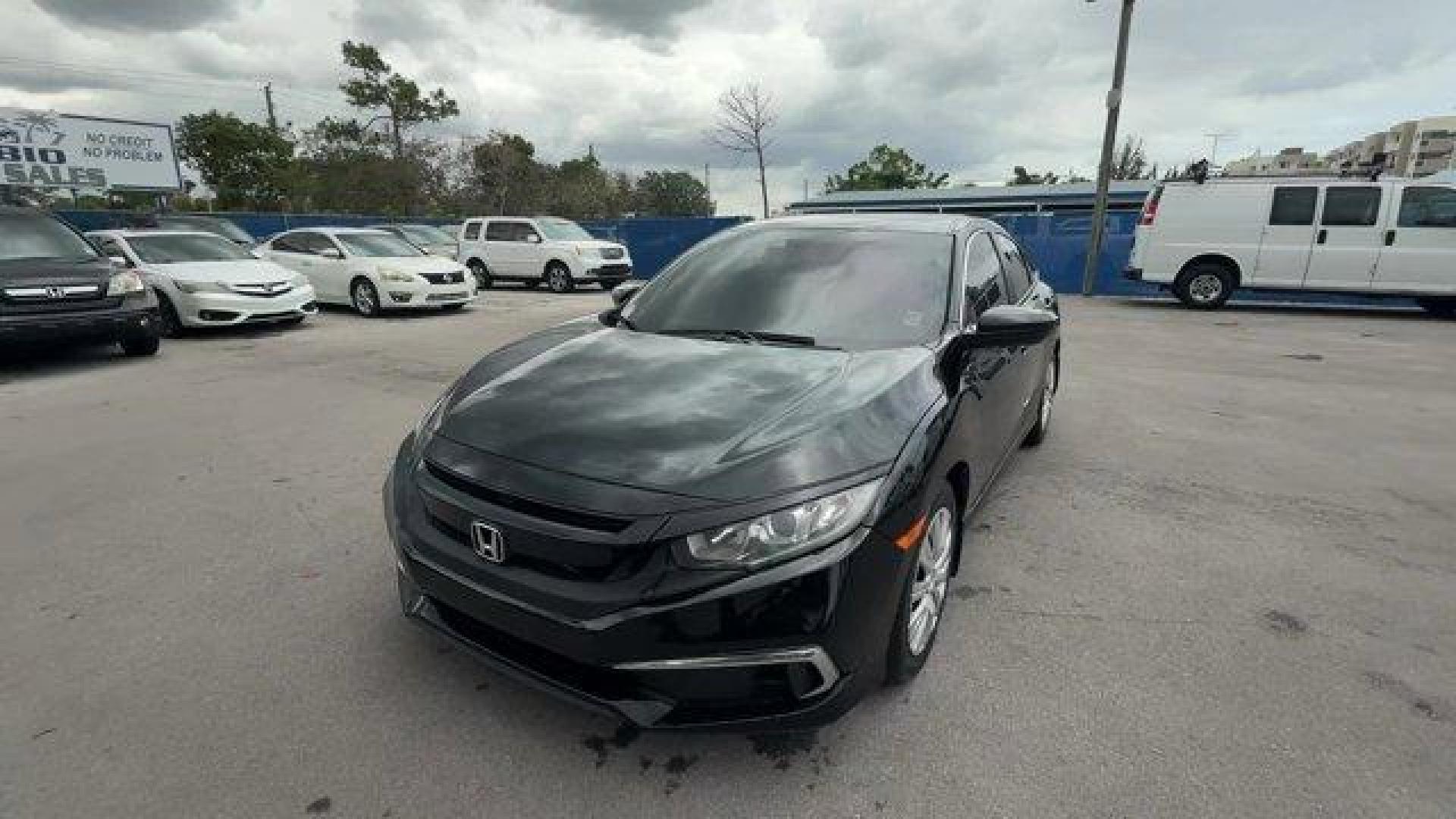 2019 Black Honda Civic Sedan (19XFC2F64KE) with an 4 2.0 L engine, Variable transmission, located at 27610 S Dixie Hwy, Homestead, FL, 33032, (305) 749-2348, 25.510241, -80.438301 - Delivers 38 Highway MPG and 30 City MPG! This Honda Civic Sedan delivers a Regular Unleaded I-4 2.0 L/122 engine powering this Variable transmission. Window Grid Antenna, Wheels: 16 w/Full Covers, VSA Electronic Stability Control (ESC).* This Honda Civic Sedan Features the Following Options *Trunk R - Photo#0