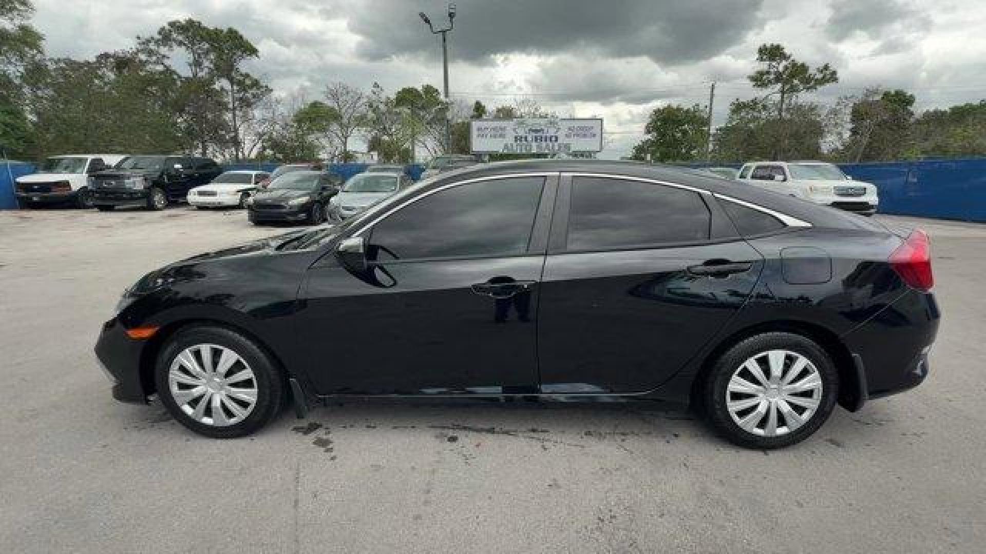 2019 Black Honda Civic Sedan (19XFC2F64KE) with an 4 2.0 L engine, Variable transmission, located at 27610 S Dixie Hwy, Homestead, FL, 33032, (305) 749-2348, 25.510241, -80.438301 - Delivers 38 Highway MPG and 30 City MPG! This Honda Civic Sedan delivers a Regular Unleaded I-4 2.0 L/122 engine powering this Variable transmission. Window Grid Antenna, Wheels: 16 w/Full Covers, VSA Electronic Stability Control (ESC).* This Honda Civic Sedan Features the Following Options *Trunk R - Photo#1
