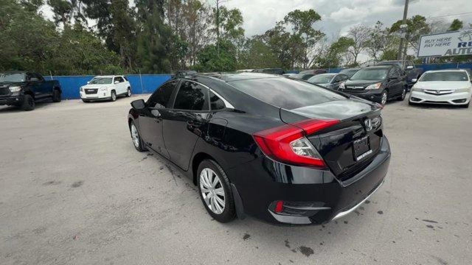 2019 Black Honda Civic Sedan (19XFC2F64KE) with an 4 2.0 L engine, Variable transmission, located at 27610 S Dixie Hwy, Homestead, FL, 33032, (305) 749-2348, 25.510241, -80.438301 - Delivers 38 Highway MPG and 30 City MPG! This Honda Civic Sedan delivers a Regular Unleaded I-4 2.0 L/122 engine powering this Variable transmission. Window Grid Antenna, Wheels: 16 w/Full Covers, VSA Electronic Stability Control (ESC).* This Honda Civic Sedan Features the Following Options *Trunk R - Photo#2