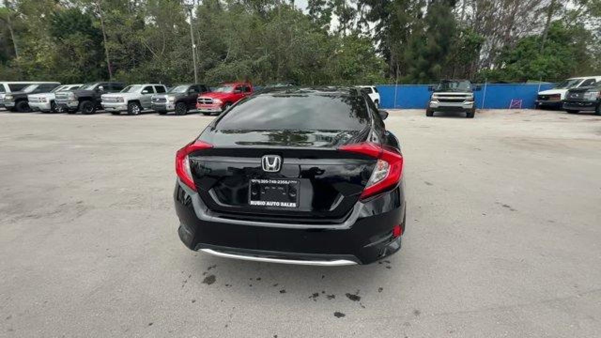 2019 Black Honda Civic Sedan (19XFC2F64KE) with an 4 2.0 L engine, Variable transmission, located at 27610 S Dixie Hwy, Homestead, FL, 33032, (305) 749-2348, 25.510241, -80.438301 - Delivers 38 Highway MPG and 30 City MPG! This Honda Civic Sedan delivers a Regular Unleaded I-4 2.0 L/122 engine powering this Variable transmission. Window Grid Antenna, Wheels: 16 w/Full Covers, VSA Electronic Stability Control (ESC).* This Honda Civic Sedan Features the Following Options *Trunk R - Photo#3