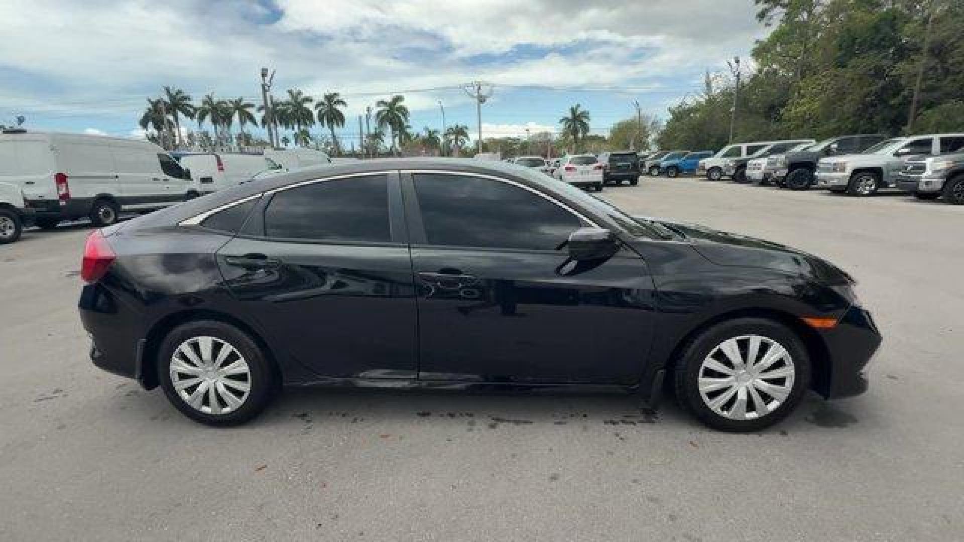 2019 Black Honda Civic Sedan (19XFC2F64KE) with an 4 2.0 L engine, Variable transmission, located at 27610 S Dixie Hwy, Homestead, FL, 33032, (305) 749-2348, 25.510241, -80.438301 - Delivers 38 Highway MPG and 30 City MPG! This Honda Civic Sedan delivers a Regular Unleaded I-4 2.0 L/122 engine powering this Variable transmission. Window Grid Antenna, Wheels: 16 w/Full Covers, VSA Electronic Stability Control (ESC).* This Honda Civic Sedan Features the Following Options *Trunk R - Photo#5