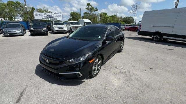 2019 Black Honda Civic Sedan (19XFC2F67KE) with an 4 2.0 L engine, Variable transmission, located at 27610 S Dixie Hwy, Homestead, FL, 33032, (305) 749-2348, 25.510241, -80.438301 - Boasts 38 Highway MPG and 30 City MPG! This Honda Civic Sedan boasts a Regular Unleaded I-4 2.0 L/122 engine powering this Variable transmission. Window Grid Antenna, Wheels: 16 w/Full Covers, VSA Electronic Stability Control (ESC).*This Honda Civic Sedan Comes Equipped with These Options *Trunk Rea - Photo#0