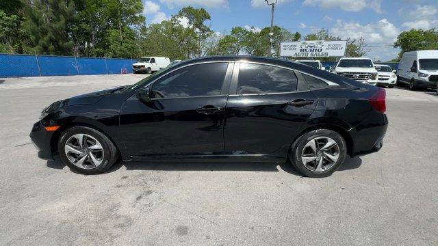 2019 Black Honda Civic Sedan (19XFC2F67KE) with an 4 2.0 L engine, Variable transmission, located at 27610 S Dixie Hwy, Homestead, FL, 33032, (305) 749-2348, 25.510241, -80.438301 - Boasts 38 Highway MPG and 30 City MPG! This Honda Civic Sedan boasts a Regular Unleaded I-4 2.0 L/122 engine powering this Variable transmission. Window Grid Antenna, Wheels: 16 w/Full Covers, VSA Electronic Stability Control (ESC).*This Honda Civic Sedan Comes Equipped with These Options *Trunk Rea - Photo#1