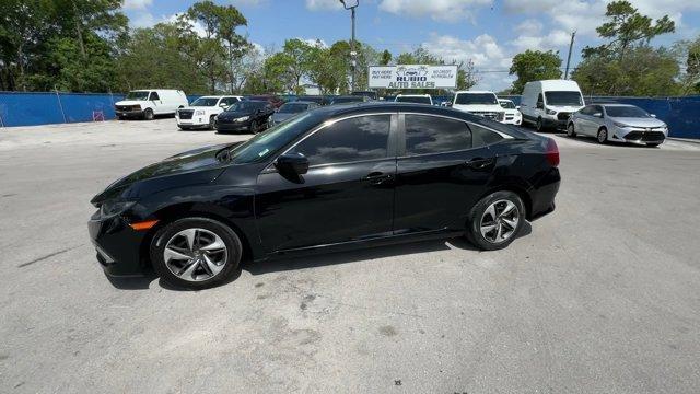 2019 Black Honda Civic Sedan (19XFC2F67KE) with an 4 2.0 L engine, Variable transmission, located at 27610 S Dixie Hwy, Homestead, FL, 33032, (305) 749-2348, 25.510241, -80.438301 - Boasts 38 Highway MPG and 30 City MPG! This Honda Civic Sedan boasts a Regular Unleaded I-4 2.0 L/122 engine powering this Variable transmission. Window Grid Antenna, Wheels: 16 w/Full Covers, VSA Electronic Stability Control (ESC).*This Honda Civic Sedan Comes Equipped with These Options *Trunk Rea - Photo#2