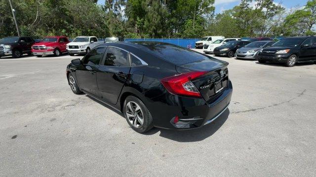 2019 Black Honda Civic Sedan (19XFC2F67KE) with an 4 2.0 L engine, Variable transmission, located at 27610 S Dixie Hwy, Homestead, FL, 33032, (305) 749-2348, 25.510241, -80.438301 - Boasts 38 Highway MPG and 30 City MPG! This Honda Civic Sedan boasts a Regular Unleaded I-4 2.0 L/122 engine powering this Variable transmission. Window Grid Antenna, Wheels: 16 w/Full Covers, VSA Electronic Stability Control (ESC).*This Honda Civic Sedan Comes Equipped with These Options *Trunk Rea - Photo#3