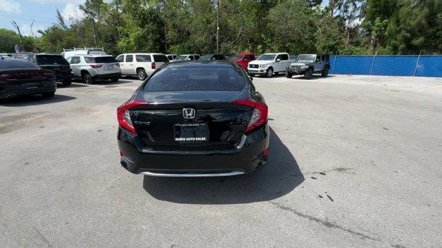 2019 Black Honda Civic Sedan (19XFC2F67KE) with an 4 2.0 L engine, Variable transmission, located at 27610 S Dixie Hwy, Homestead, FL, 33032, (305) 749-2348, 25.510241, -80.438301 - Boasts 38 Highway MPG and 30 City MPG! This Honda Civic Sedan boasts a Regular Unleaded I-4 2.0 L/122 engine powering this Variable transmission. Window Grid Antenna, Wheels: 16 w/Full Covers, VSA Electronic Stability Control (ESC).*This Honda Civic Sedan Comes Equipped with These Options *Trunk Rea - Photo#4