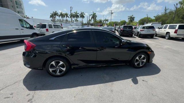 2019 Black Honda Civic Sedan (19XFC2F67KE) with an 4 2.0 L engine, Variable transmission, located at 27610 S Dixie Hwy, Homestead, FL, 33032, (305) 749-2348, 25.510241, -80.438301 - Boasts 38 Highway MPG and 30 City MPG! This Honda Civic Sedan boasts a Regular Unleaded I-4 2.0 L/122 engine powering this Variable transmission. Window Grid Antenna, Wheels: 16 w/Full Covers, VSA Electronic Stability Control (ESC).*This Honda Civic Sedan Comes Equipped with These Options *Trunk Rea - Photo#6