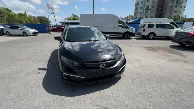 2019 Black Honda Civic Sedan (19XFC2F67KE) with an 4 2.0 L engine, Variable transmission, located at 27610 S Dixie Hwy, Homestead, FL, 33032, (305) 749-2348, 25.510241, -80.438301 - Boasts 38 Highway MPG and 30 City MPG! This Honda Civic Sedan boasts a Regular Unleaded I-4 2.0 L/122 engine powering this Variable transmission. Window Grid Antenna, Wheels: 16 w/Full Covers, VSA Electronic Stability Control (ESC).*This Honda Civic Sedan Comes Equipped with These Options *Trunk Rea - Photo#8