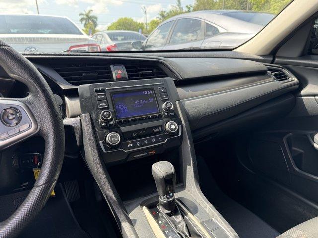 2019 Black Honda Civic Sedan (19XFC2F67KE) with an 4 2.0 L engine, Variable transmission, located at 27610 S Dixie Hwy, Homestead, FL, 33032, (305) 749-2348, 25.510241, -80.438301 - Boasts 38 Highway MPG and 30 City MPG! This Honda Civic Sedan boasts a Regular Unleaded I-4 2.0 L/122 engine powering this Variable transmission. Window Grid Antenna, Wheels: 16 w/Full Covers, VSA Electronic Stability Control (ESC).*This Honda Civic Sedan Comes Equipped with These Options *Trunk Rea - Photo#9