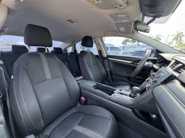 2019 Black Honda Civic Sedan (19XFC2F67KE) with an 4 2.0 L engine, Variable transmission, located at 27610 S Dixie Hwy, Homestead, FL, 33032, (305) 749-2348, 25.510241, -80.438301 - Boasts 38 Highway MPG and 30 City MPG! This Honda Civic Sedan boasts a Regular Unleaded I-4 2.0 L/122 engine powering this Variable transmission. Window Grid Antenna, Wheels: 16 w/Full Covers, VSA Electronic Stability Control (ESC).*This Honda Civic Sedan Comes Equipped with These Options *Trunk Rea - Photo#12