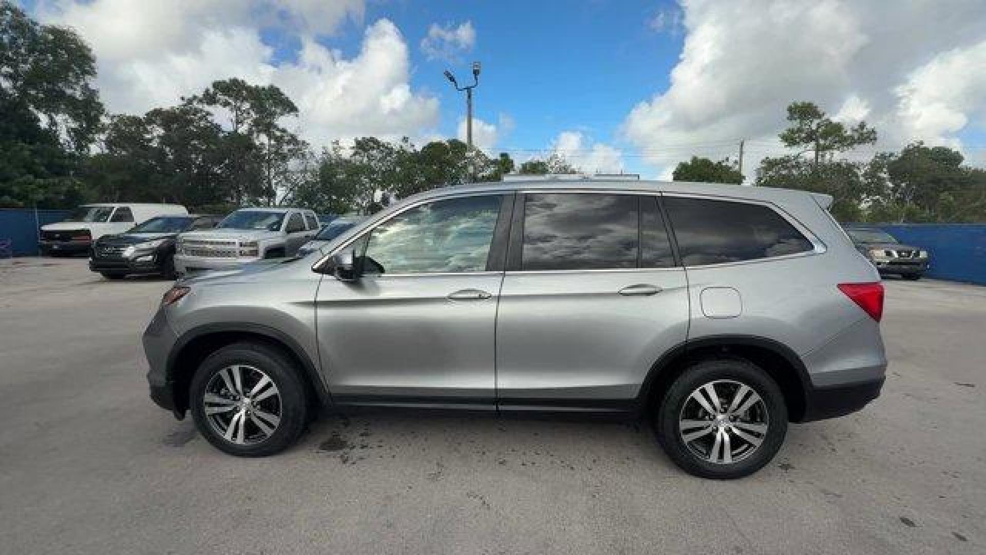 2017 Silver Honda Pilot (5FNYF5H36HB) with an 6 3.5 L engine, Automatic transmission, located at 27610 S Dixie Hwy, Homestead, FL, 33032, (305) 749-2348, 25.510241, -80.438301 - IIHS Top Safety Pick+. Boasts 27 Highway MPG and 19 City MPG! This Honda Pilot delivers a Regular Unleaded V-6 3.5 L/212 engine powering this Automatic transmission. Window Grid Antenna, Wheels: 18 Alloy, Wheels w/Machined Accents.* This Honda Pilot Features the Following Options *VSA Electronic Sta - Photo#1