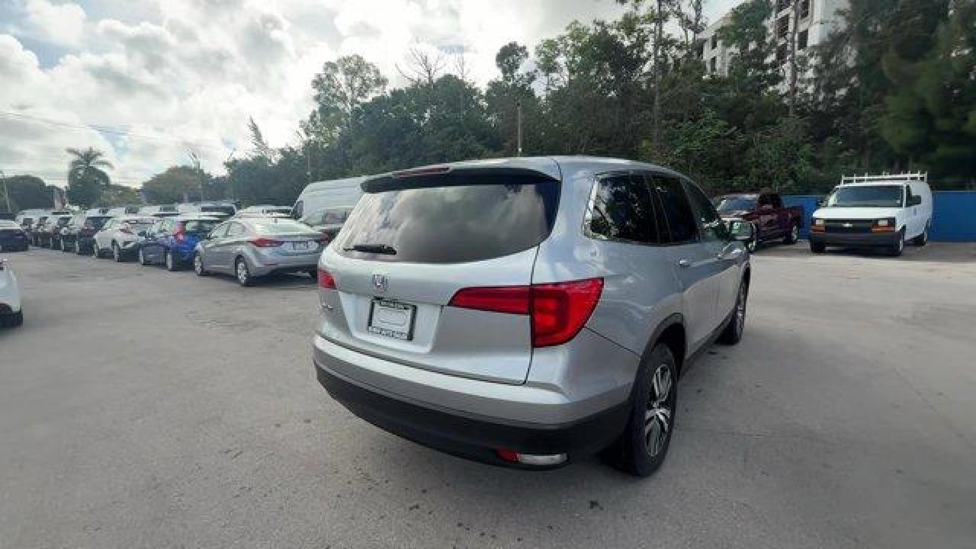 2017 Silver Honda Pilot (5FNYF5H36HB) with an 6 3.5 L engine, Automatic transmission, located at 27610 S Dixie Hwy, Homestead, FL, 33032, (305) 749-2348, 25.510241, -80.438301 - IIHS Top Safety Pick+. Boasts 27 Highway MPG and 19 City MPG! This Honda Pilot delivers a Regular Unleaded V-6 3.5 L/212 engine powering this Automatic transmission. Window Grid Antenna, Wheels: 18 Alloy, Wheels w/Machined Accents.* This Honda Pilot Features the Following Options *VSA Electronic Sta - Photo#4