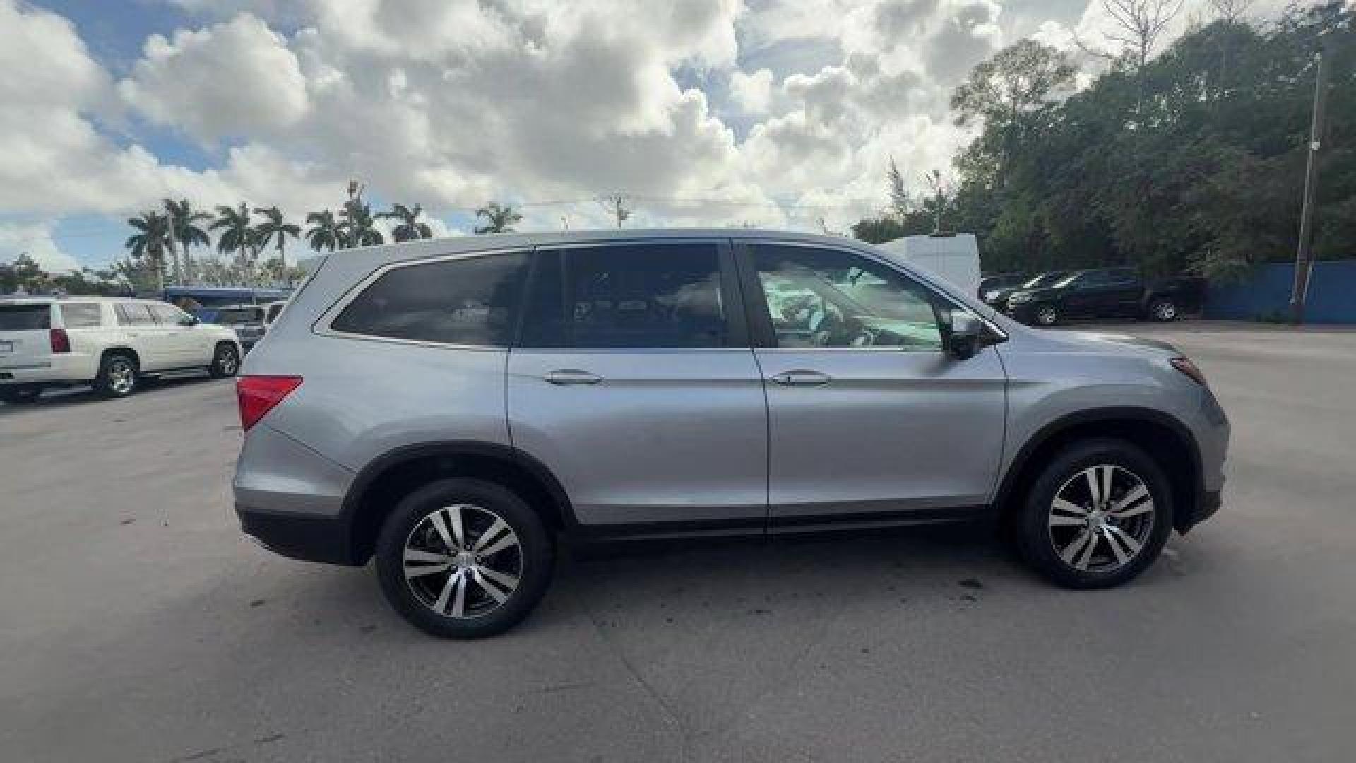 2017 Silver Honda Pilot (5FNYF5H36HB) with an 6 3.5 L engine, Automatic transmission, located at 27610 S Dixie Hwy, Homestead, FL, 33032, (305) 749-2348, 25.510241, -80.438301 - IIHS Top Safety Pick+. Boasts 27 Highway MPG and 19 City MPG! This Honda Pilot delivers a Regular Unleaded V-6 3.5 L/212 engine powering this Automatic transmission. Window Grid Antenna, Wheels: 18 Alloy, Wheels w/Machined Accents.* This Honda Pilot Features the Following Options *VSA Electronic Sta - Photo#5