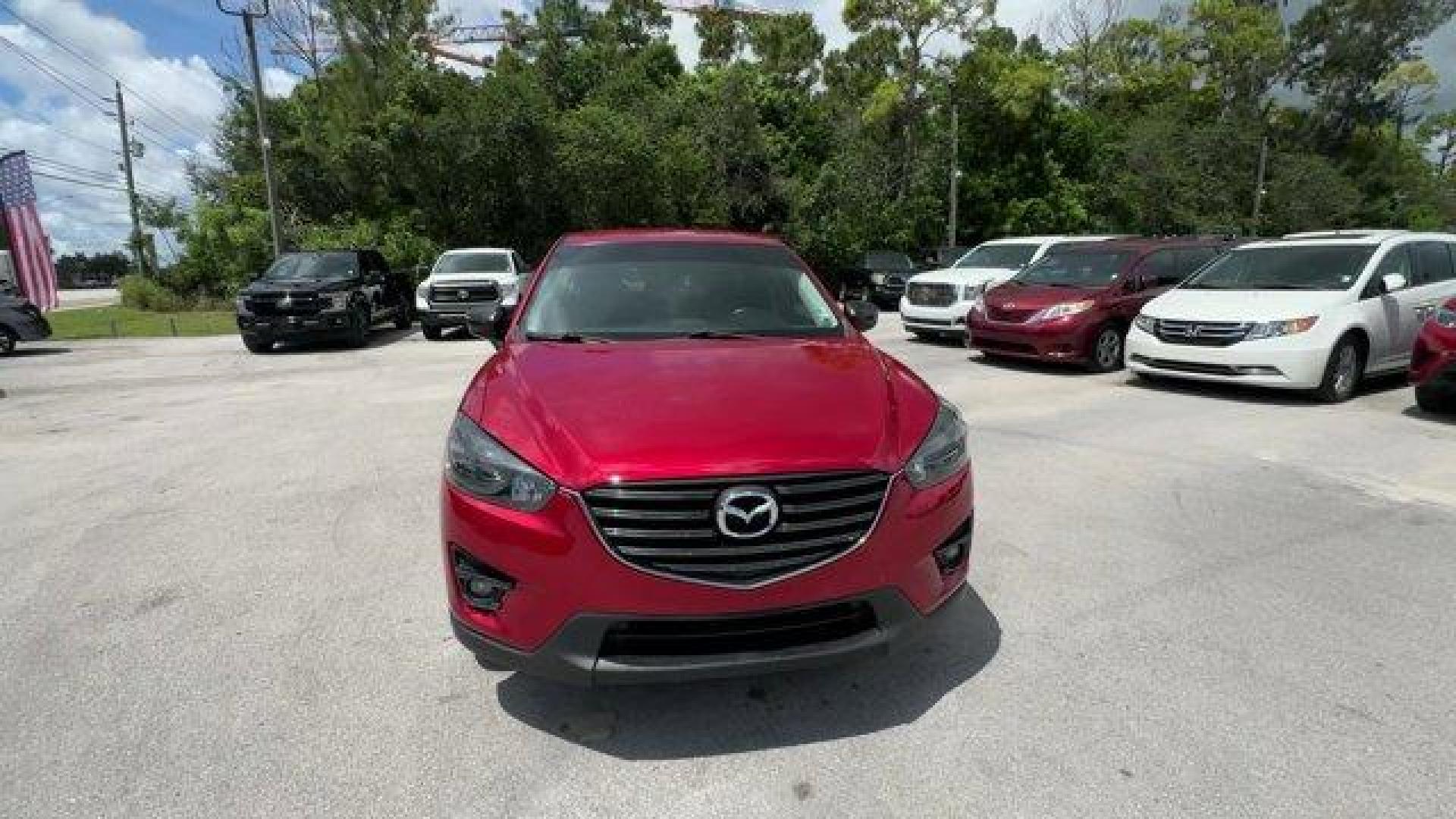 2016 Soul Red Metallic /Black Mazda CX-5 (JM3KE2CY4G0) with an 4 2.5 L engine, Automatic transmission, located at 27610 S Dixie Hwy, Homestead, FL, 33032, (305) 749-2348, 25.510241, -80.438301 - Only 10,120 Miles! Boasts 33 Highway MPG and 26 City MPG! This Mazda CX-5 delivers a Regular Unleaded I-4 2.5 L/152 engine powering this Automatic transmission. SOUL RED METALLIC PAINT, SOUL RED METALLIC, BLACK, CLOTH SEAT TRIM.*This Mazda CX-5 Comes Equipped with These Options *Wheels: 17 x 7J Alum - Photo#7