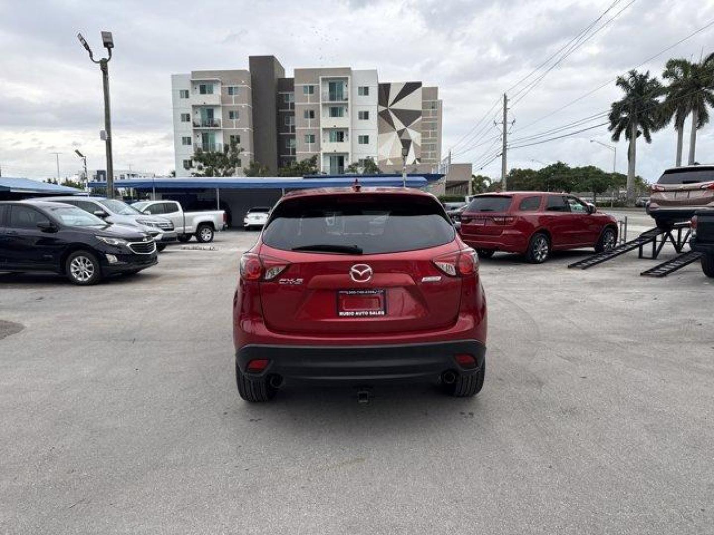 2016 Soul Red Metallic /Black Mazda CX-5 (JM3KE2CY4G0) with an 4 2.5 L engine, Automatic transmission, located at 27610 S Dixie Hwy, Homestead, FL, 33032, (305) 749-2348, 25.510241, -80.438301 - Only 10,120 Miles! Boasts 33 Highway MPG and 26 City MPG! This Mazda CX-5 delivers a Regular Unleaded I-4 2.5 L/152 engine powering this Automatic transmission. SOUL RED METALLIC PAINT, SOUL RED METALLIC, BLACK, CLOTH SEAT TRIM.*This Mazda CX-5 Comes Equipped with These Options *Wheels: 17 x 7J Alum - Photo#3
