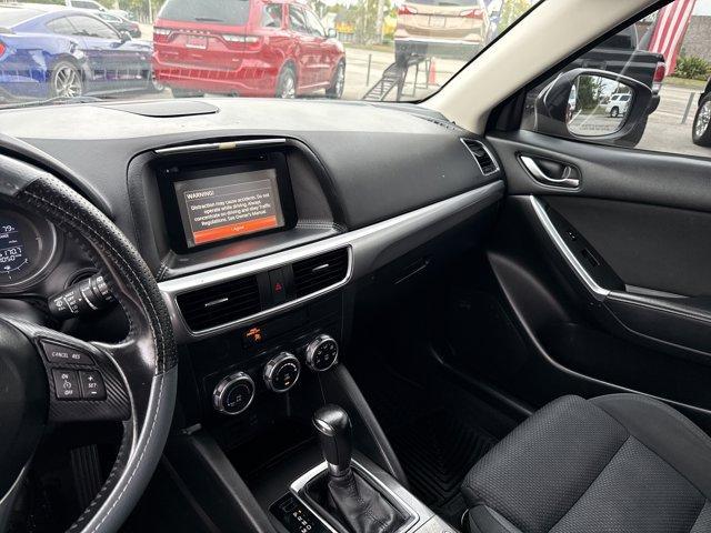 2016 Soul Red Metallic /Black Mazda CX-5 (JM3KE2CY4G0) with an 4 2.5 L engine, Automatic transmission, located at 27610 S Dixie Hwy, Homestead, FL, 33032, (305) 749-2348, 25.510241, -80.438301 - Only 10,120 Miles! Boasts 33 Highway MPG and 26 City MPG! This Mazda CX-5 delivers a Regular Unleaded I-4 2.5 L/152 engine powering this Automatic transmission. SOUL RED METALLIC PAINT, SOUL RED METALLIC, BLACK, CLOTH SEAT TRIM.*This Mazda CX-5 Comes Equipped with These Options *Wheels: 17 x 7J Alum - Photo#10