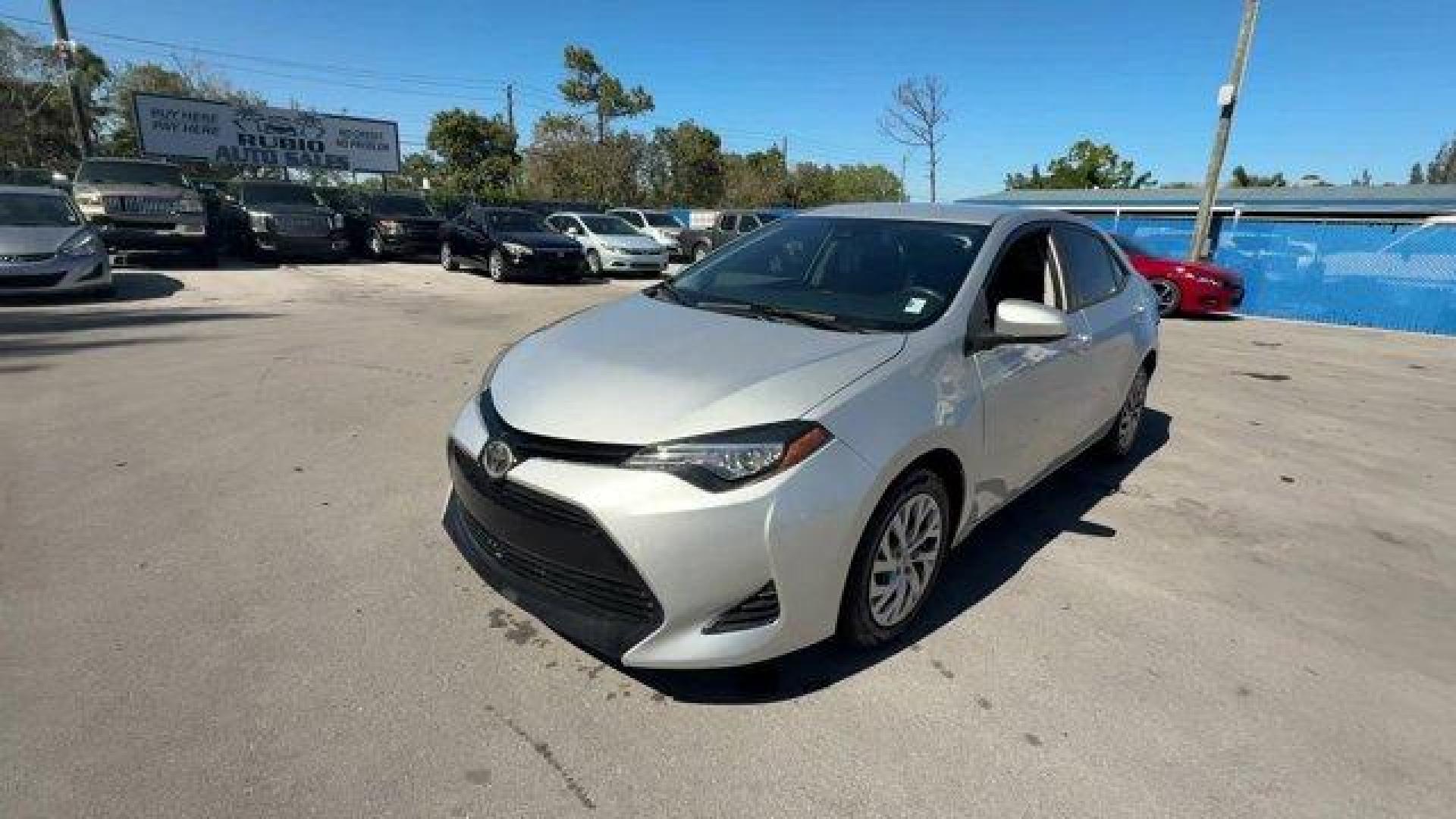 2017 Silver Toyota Corolla (5YFBURHE1HP) with an 4 1.8 L engine, Variable transmission, located at 27610 S Dixie Hwy, Homestead, FL, 33032, (305) 749-2348, 25.510241, -80.438301 - KBB.com 10 Best Used Cars Under $15,000. This Toyota Corolla boasts a Regular Unleaded I-4 1.8 L/110 engine powering this Variable transmission. Urethane Gear Shifter Material, Trunk Rear Cargo Access, Trip Computer.* This Toyota Corolla Features the Following Options *Transmission: Continuously Var - Photo#0