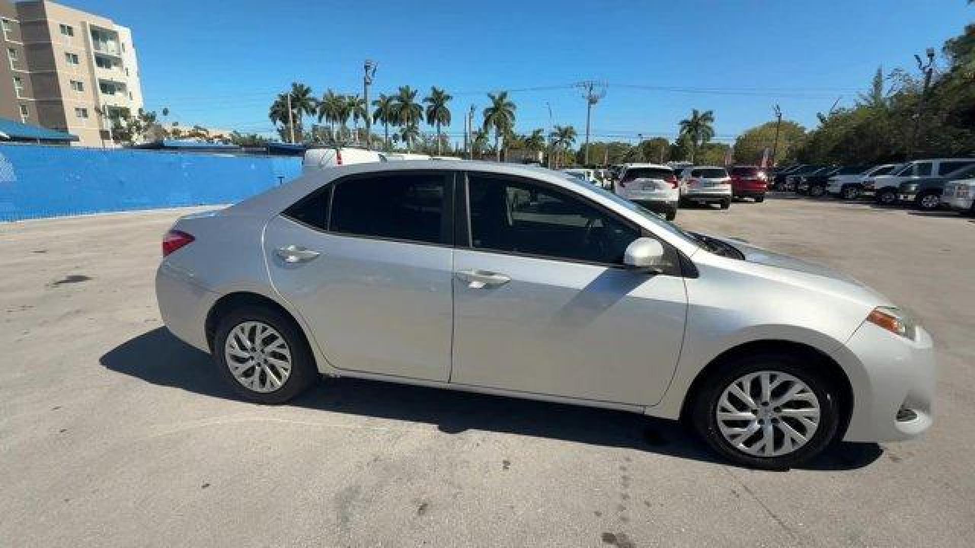 2017 Silver Toyota Corolla (5YFBURHE1HP) with an 4 1.8 L engine, Variable transmission, located at 27610 S Dixie Hwy, Homestead, FL, 33032, (305) 749-2348, 25.510241, -80.438301 - KBB.com 10 Best Used Cars Under $15,000. This Toyota Corolla boasts a Regular Unleaded I-4 1.8 L/110 engine powering this Variable transmission. Urethane Gear Shifter Material, Trunk Rear Cargo Access, Trip Computer.* This Toyota Corolla Features the Following Options *Transmission: Continuously Var - Photo#5