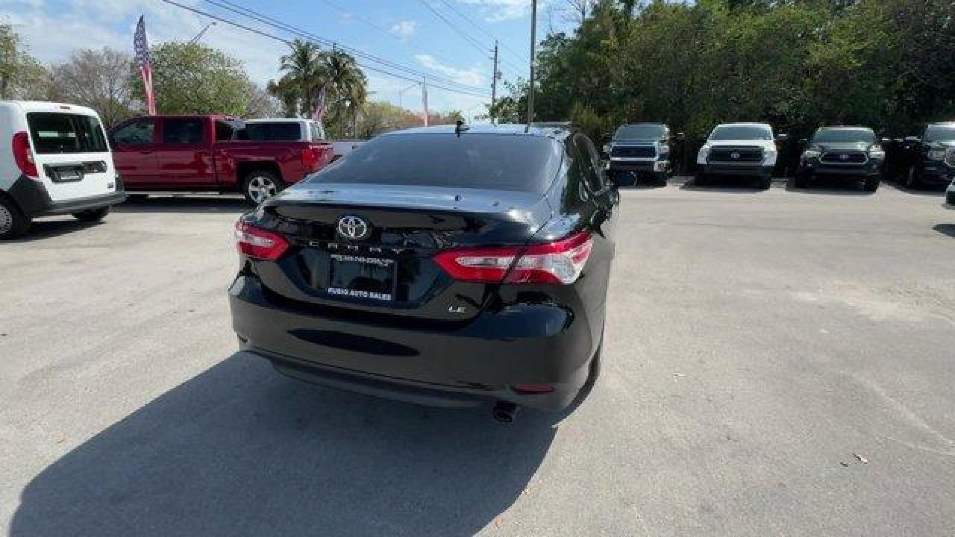 2019 Black Toyota Camry (4T1B11HK0KU) with an 4 2.5 L engine, Automatic transmission, located at 27610 S Dixie Hwy, Homestead, FL, 33032, (305) 749-2348, 25.510241, -80.438301 - KBB.com 10 Most Comfortable Cars Under $30,000. This Toyota Camry boasts a Regular Unleaded I-4 2.5 L/152 engine powering this Automatic transmission. Window Grid And Roof Mount Antenna, Variable Intermittent Wipers, Valet Function.*This Toyota Camry Comes Equipped with These Options *Trunk Rear Car - Photo#4
