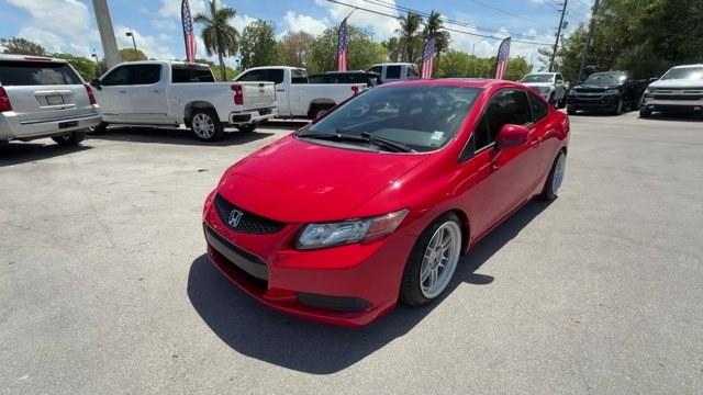 2012 Red Honda Civic Cpe (2HGFG4A50CH) with an 4 2.4L engine, Manual transmission, located at 27610 S Dixie Hwy, Homestead, FL, 33032, (305) 749-2348, 25.510241, -80.438301 - KBB.com Brand Image Awards. Only 105,663 Miles! Scores 31 Highway MPG and 22 City MPG! This Honda Civic Cpe delivers a Gas I4 2.4L/144 engine powering this Manual transmission. Vehicle Stability Assist (VSA) w/traction control, Variable intermittent windshield wipers, USB audio interface.*This Honda - Photo#0