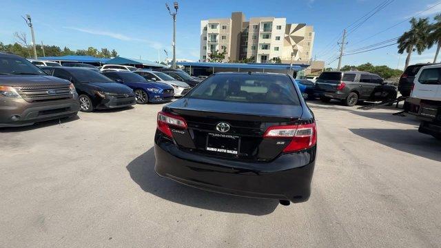 2014 Black Toyota Camry (4T1BF1FK1EU) with an 4 2.5 L engine, Automatic transmission, located at 27610 S Dixie Hwy, Homestead, FL, 33032, (305) 749-2348, 25.510241, -80.438301 - KBB.com 10 Best Hybrid Cars Under $30,000. Only 101,356 Miles! Delivers 35 Highway MPG and 25 City MPG! This Toyota Camry delivers a Regular Unleaded I-4 2.5 L/152 engine powering this Automatic transmission. Window Grid Antenna, Valet Function, Trunk Rear Cargo Access.*This Toyota Camry Comes Equip - Photo#3