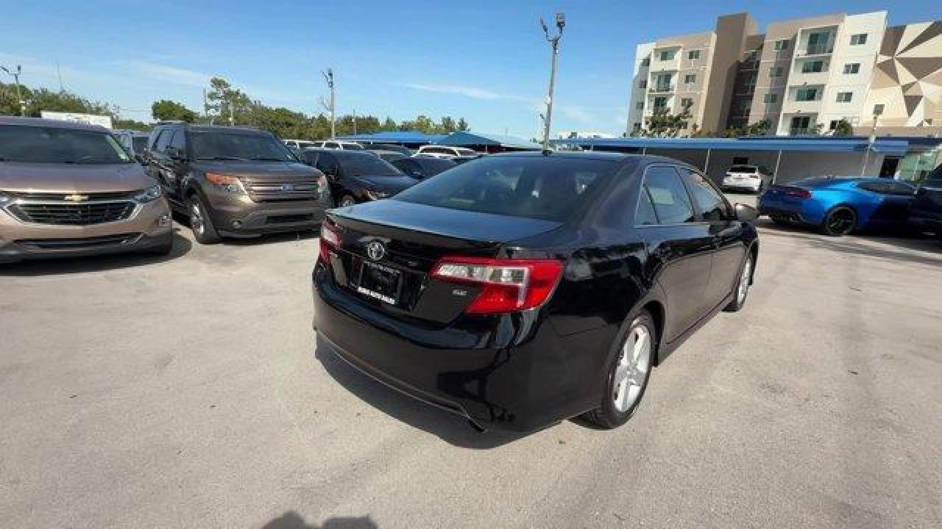 2014 Black Toyota Camry (4T1BF1FK1EU) with an 4 2.5 L engine, Automatic transmission, located at 27610 S Dixie Hwy, Homestead, FL, 33032, (305) 749-2348, 25.510241, -80.438301 - KBB.com 10 Best Hybrid Cars Under $30,000. Only 101,356 Miles! Delivers 35 Highway MPG and 25 City MPG! This Toyota Camry delivers a Regular Unleaded I-4 2.5 L/152 engine powering this Automatic transmission. Window Grid Antenna, Valet Function, Trunk Rear Cargo Access.*This Toyota Camry Comes Equip - Photo#4