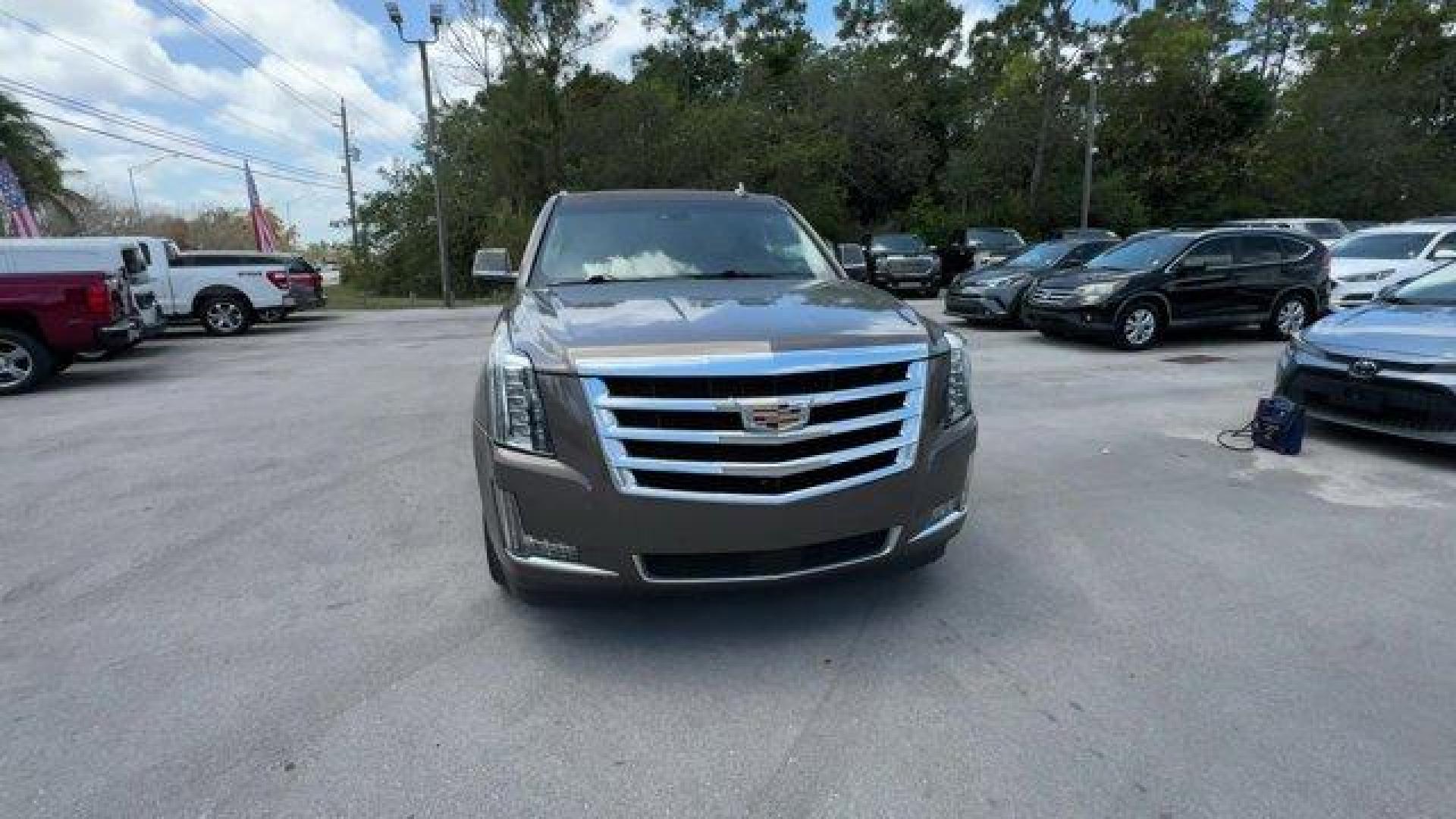 2016 Terra Mocha Metallic /Shale with Cocoa Accents Cadillac Escalade ESV (1GYS3JKJ2GR) with an 8 6.2L engine, Automatic transmission, located at 27610 S Dixie Hwy, Homestead, FL, 33032, (305) 749-2348, 25.510241, -80.438301 - Delivers 22 Highway MPG and 15 City MPG! This Cadillac Escalade ESV boasts a Gas V8 6.2L/376 engine powering this Automatic transmission. WHEELS, 22 X 9 (55.9 CM X 22.9 CM) DUAL 7-SPOKE ULTRA-BRIGHT FINISH ALUMINUM WITH PREMIUM PAINT, TRANSMISSION, 8-SPEED AUTOMATIC, 8L90 (STD), TERRA MOCHA METALLIC - Photo#7