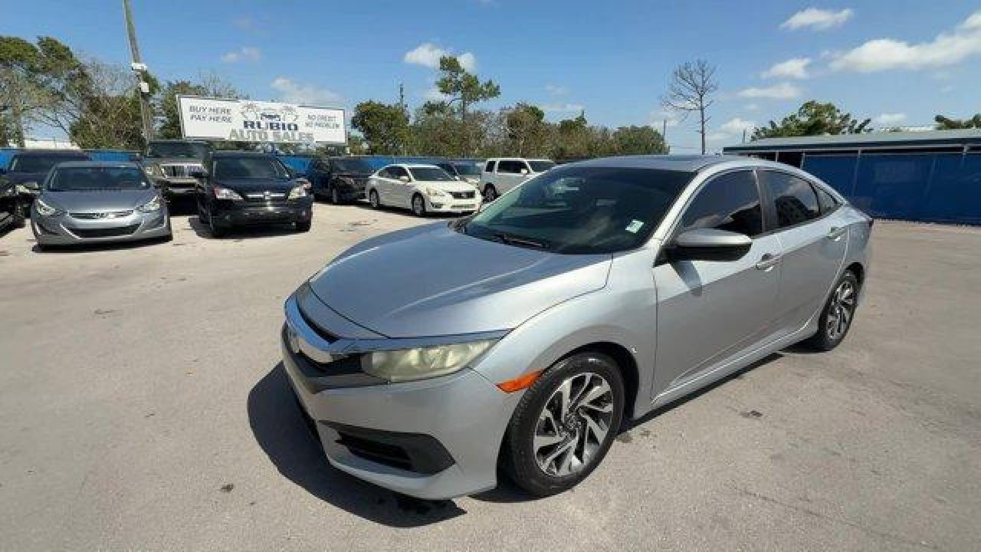 2018 Silver Honda Civic Sedan (19XFC2F78JE) with an 4 2.0 L engine, Variable transmission, located at 27610 S Dixie Hwy, Homestead, FL, 33032, (305) 749-2348, 25.510241, -80.438301 - KBB.com 10 Most Awarded Brands. Scores 40 Highway MPG and 31 City MPG! This Honda Civic Sedan delivers a Regular Unleaded I-4 2.0 L/122 engine powering this Variable transmission. Wheels: 16 Alloy, Wheels w/Silver Accents, VSA Electronic Stability Control (ESC).* This Honda Civic Sedan Features the - Photo#0