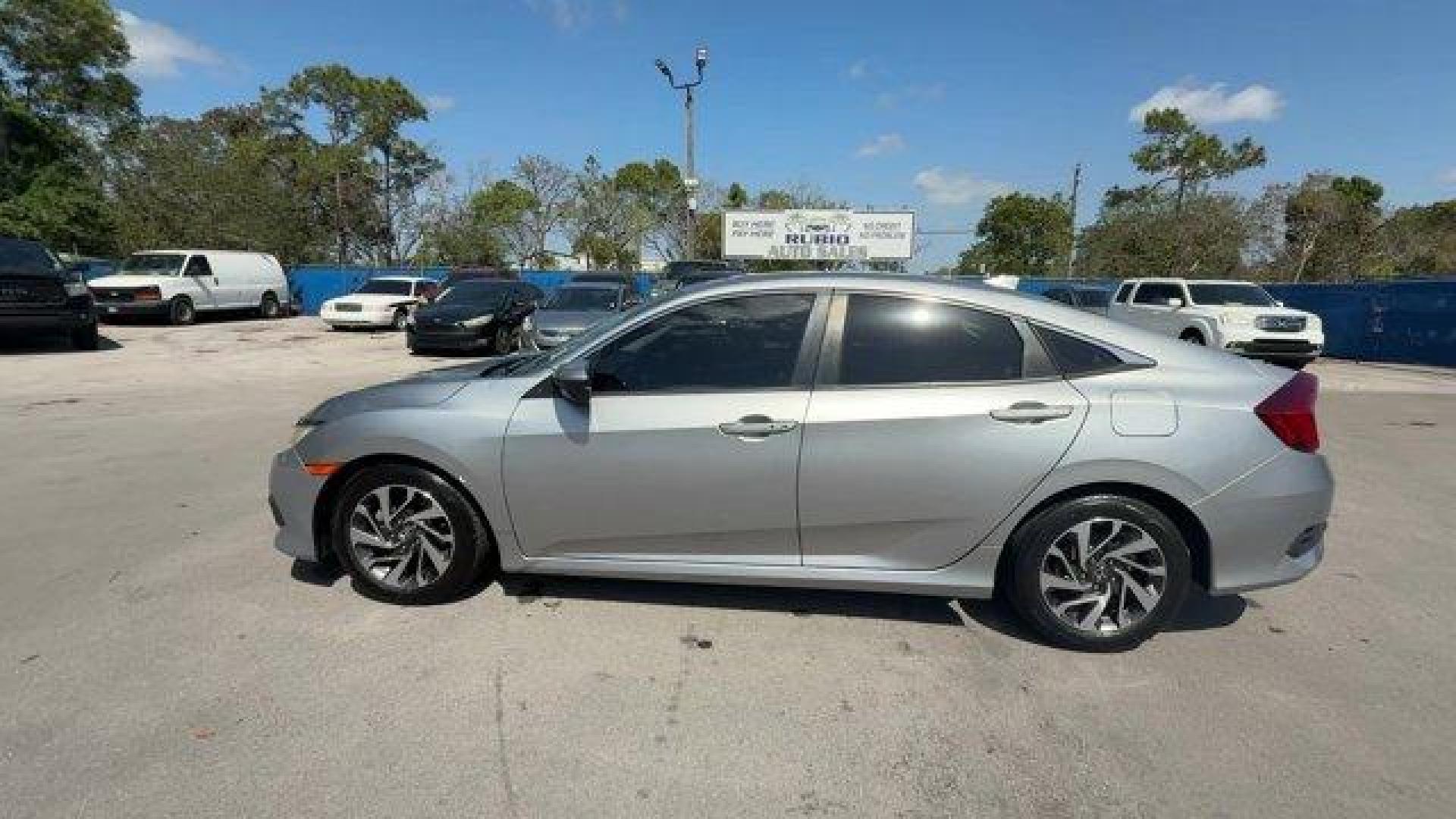 2018 Silver Honda Civic Sedan (19XFC2F78JE) with an 4 2.0 L engine, Variable transmission, located at 27610 S Dixie Hwy, Homestead, FL, 33032, (305) 749-2348, 25.510241, -80.438301 - KBB.com 10 Most Awarded Brands. Scores 40 Highway MPG and 31 City MPG! This Honda Civic Sedan delivers a Regular Unleaded I-4 2.0 L/122 engine powering this Variable transmission. Wheels: 16 Alloy, Wheels w/Silver Accents, VSA Electronic Stability Control (ESC).* This Honda Civic Sedan Features the - Photo#1