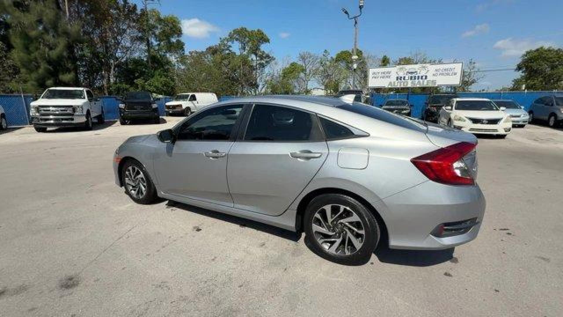 2018 Silver Honda Civic Sedan (19XFC2F78JE) with an 4 2.0 L engine, Variable transmission, located at 27610 S Dixie Hwy, Homestead, FL, 33032, (305) 749-2348, 25.510241, -80.438301 - KBB.com 10 Most Awarded Brands. Scores 40 Highway MPG and 31 City MPG! This Honda Civic Sedan delivers a Regular Unleaded I-4 2.0 L/122 engine powering this Variable transmission. Wheels: 16 Alloy, Wheels w/Silver Accents, VSA Electronic Stability Control (ESC).* This Honda Civic Sedan Features the - Photo#2