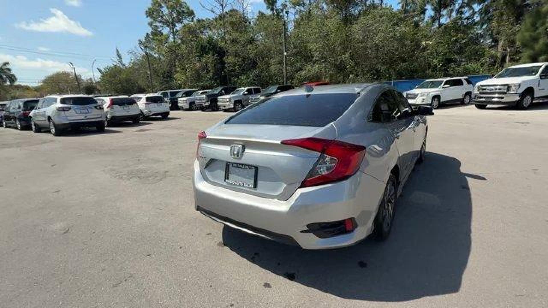 2018 Silver Honda Civic Sedan (19XFC2F78JE) with an 4 2.0 L engine, Variable transmission, located at 27610 S Dixie Hwy, Homestead, FL, 33032, (305) 749-2348, 25.510241, -80.438301 - KBB.com 10 Most Awarded Brands. Scores 40 Highway MPG and 31 City MPG! This Honda Civic Sedan delivers a Regular Unleaded I-4 2.0 L/122 engine powering this Variable transmission. Wheels: 16 Alloy, Wheels w/Silver Accents, VSA Electronic Stability Control (ESC).* This Honda Civic Sedan Features the - Photo#4