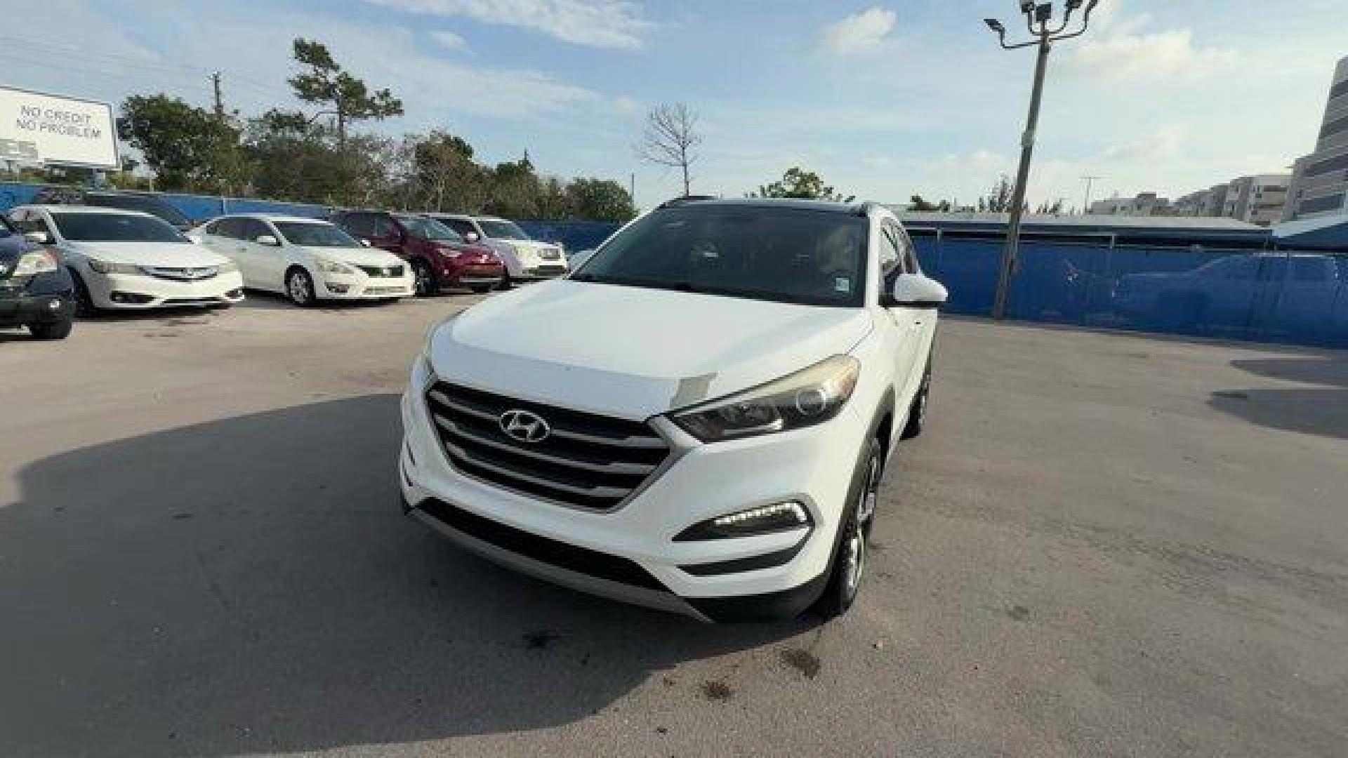 2017 Dazzling White /Gray Hyundai Tucson (KM8J33A28HU) with an 4 1.6 L engine, Automatic transmission, located at 27610 S Dixie Hwy, Homestead, FL, 33032, (305) 749-2348, 25.510241, -80.438301 - IIHS Top Safety Pick. Delivers 32 Highway MPG and 26 City MPG! This Hyundai Tucson delivers a Intercooled Turbo Regular Unleaded I-4 1.6 L/97 engine powering this Automatic transmission. OPTION GROUP 01, GRAY, YES ESSENTIALS CLOTH SEAT TRIM -inc: odor resistant cloth, FIRST AID KIT.*This Hyundai Tuc - Photo#0