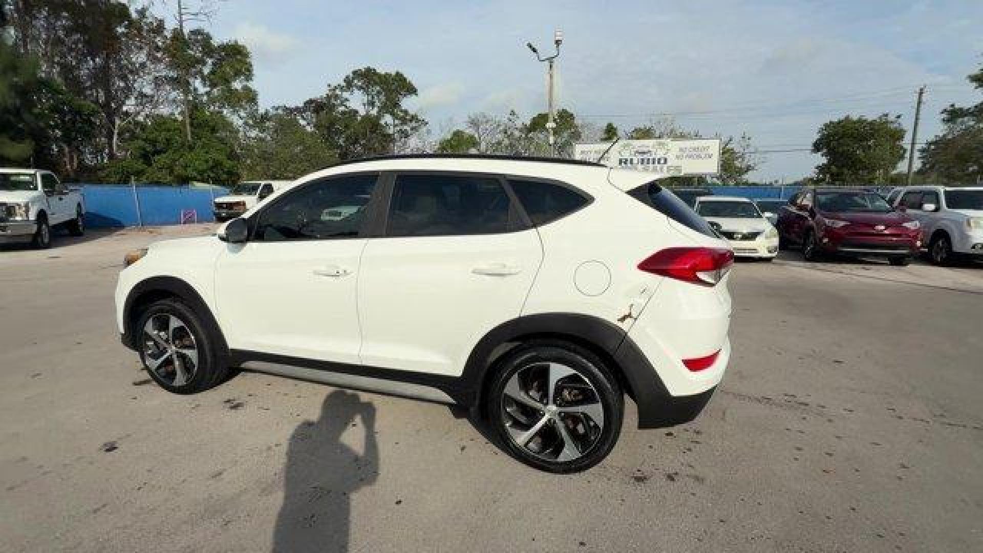 2017 Dazzling White /Gray Hyundai Tucson (KM8J33A28HU) with an 4 1.6 L engine, Automatic transmission, located at 27610 S Dixie Hwy, Homestead, FL, 33032, (305) 749-2348, 25.510241, -80.438301 - IIHS Top Safety Pick. Delivers 32 Highway MPG and 26 City MPG! This Hyundai Tucson delivers a Intercooled Turbo Regular Unleaded I-4 1.6 L/97 engine powering this Automatic transmission. OPTION GROUP 01, GRAY, YES ESSENTIALS CLOTH SEAT TRIM -inc: odor resistant cloth, FIRST AID KIT.*This Hyundai Tuc - Photo#2