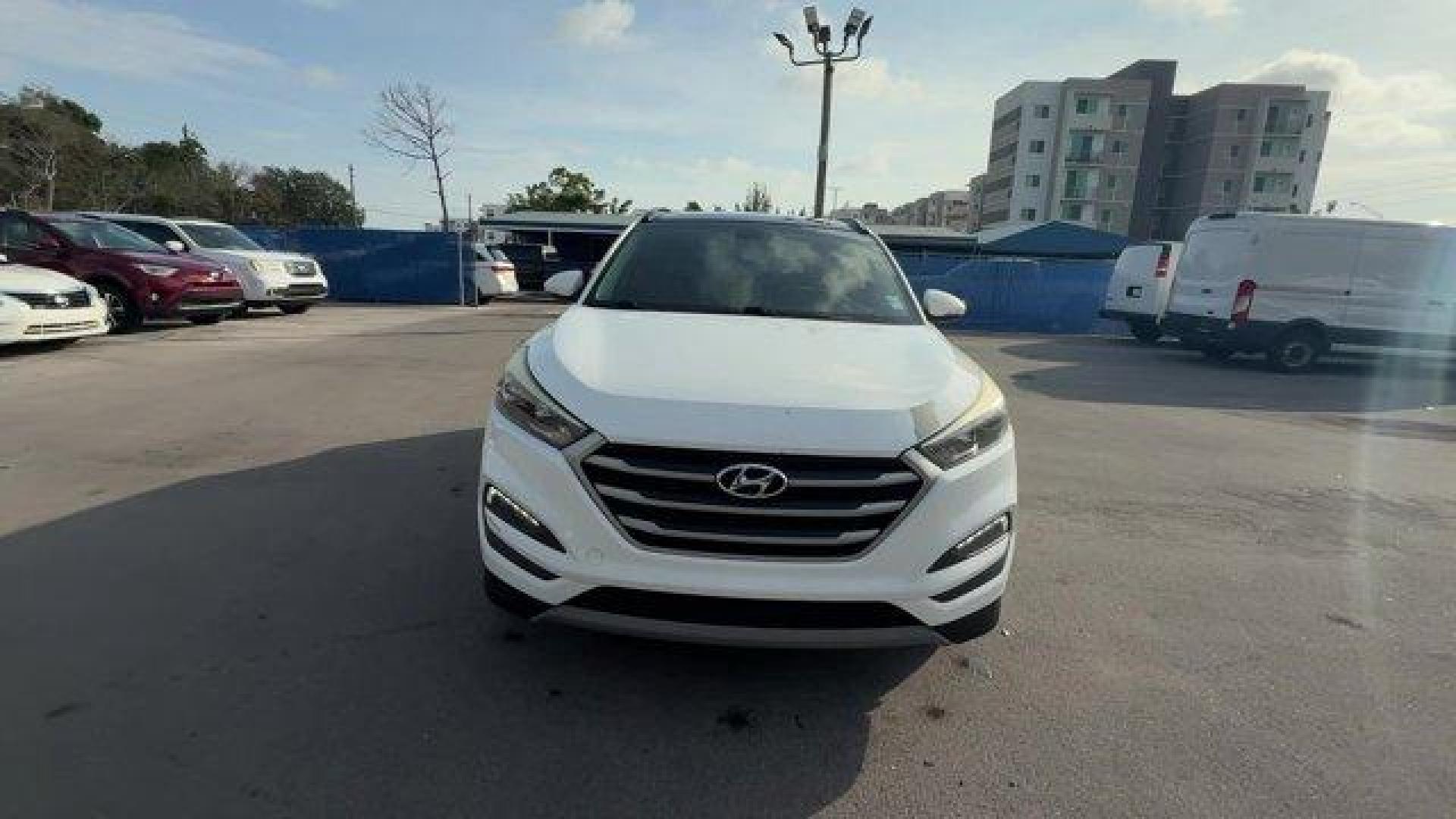 2017 Dazzling White /Gray Hyundai Tucson (KM8J33A28HU) with an 4 1.6 L engine, Automatic transmission, located at 27610 S Dixie Hwy, Homestead, FL, 33032, (305) 749-2348, 25.510241, -80.438301 - IIHS Top Safety Pick. Delivers 32 Highway MPG and 26 City MPG! This Hyundai Tucson delivers a Intercooled Turbo Regular Unleaded I-4 1.6 L/97 engine powering this Automatic transmission. OPTION GROUP 01, GRAY, YES ESSENTIALS CLOTH SEAT TRIM -inc: odor resistant cloth, FIRST AID KIT.*This Hyundai Tuc - Photo#7