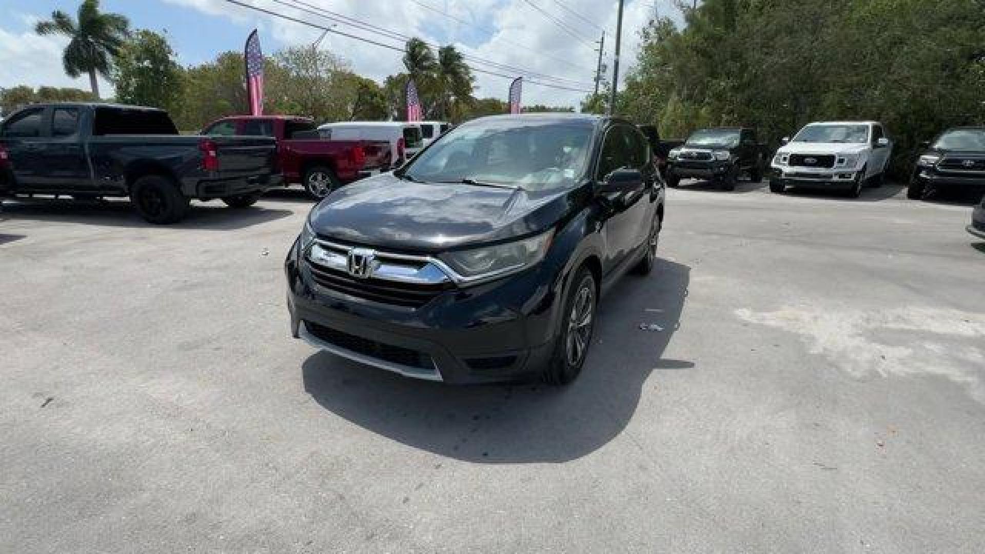 2017 Black Honda CR-V (5J6RW5H3XHL) with an 4 2.4 L engine, Variable transmission, located at 27610 S Dixie Hwy, Homestead, FL, 33032, (305) 749-2348, 25.510241, -80.438301 - KBB.com 10 Most Awarded Brands. Scores 32 Highway MPG and 26 City MPG! This Honda CR-V delivers a Regular Unleaded I-4 2.4 L/144 engine powering this Variable transmission. Wheels: 17 Alloy, Valet Function, Urethane Gear Shifter Material.* This Honda CR-V Features the Following Options *Trip Compute - Photo#0