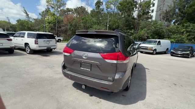 2013 Gray Toyota Sienna (5TDDK3DC2DS) with an 6 3.5L engine, Automatic transmission, located at 27610 S Dixie Hwy, Homestead, FL, 33032, (305) 749-2348, 25.510241, -80.438301 - KBB.com Brand Image Awards. Delivers 23 Highway MPG and 16 City MPG! This Toyota Sienna boasts a Gas V6 3.5L/211 engine powering this Automatic transmission. Wood grain-style sliding center console -inc: illuminated storage, illuminated front cup holders, Washer-linked variable intermittent wipers -- Photo#4