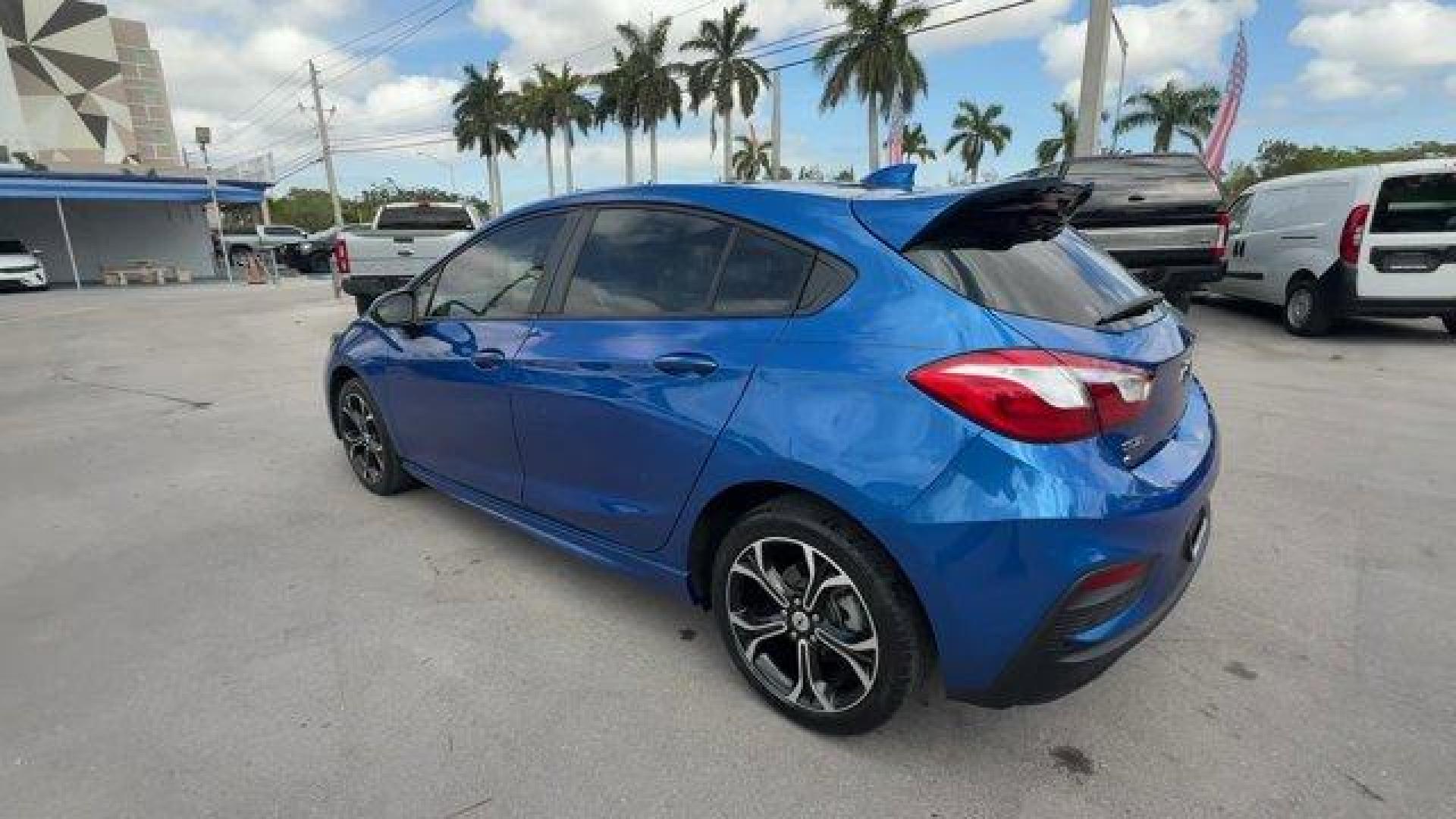 2019 Kinetic Blue Metallic /Jet Black Chevrolet Cruze (3G1BE6SM9KS) with an 4 1.4L engine, Automatic transmission, located at 27610 S Dixie Hwy, Homestead, FL, 33032, (305) 749-2348, 25.510241, -80.438301 - Delivers 38 Highway MPG and 28 City MPG! This Chevrolet Cruze delivers a Turbocharged Gas I4 1.4L/85 engine powering this Automatic transmission. TRANSMISSION, 6-SPEED AUTOMATIC (STD), SEATS, FRONT BUCKET WITH RECLINING SEATBACKS AND ADJUSTABLE HEAD RESTRAINTS (STD), LT PREFERRED EQUIPMENT GROUP inc - Photo#2