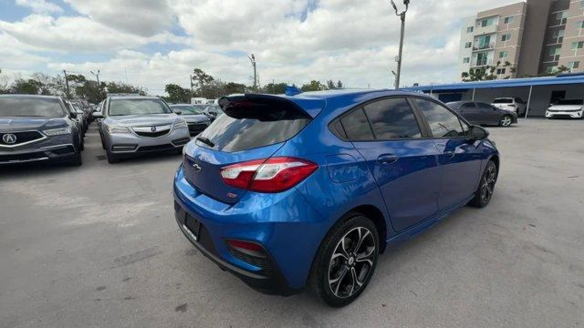 2019 Kinetic Blue Metallic /Jet Black Chevrolet Cruze (3G1BE6SM9KS) with an 4 1.4L engine, Automatic transmission, located at 27610 S Dixie Hwy, Homestead, FL, 33032, (305) 749-2348, 25.510241, -80.438301 - Delivers 38 Highway MPG and 28 City MPG! This Chevrolet Cruze delivers a Turbocharged Gas I4 1.4L/85 engine powering this Automatic transmission. TRANSMISSION, 6-SPEED AUTOMATIC (STD), SEATS, FRONT BUCKET WITH RECLINING SEATBACKS AND ADJUSTABLE HEAD RESTRAINTS (STD), LT PREFERRED EQUIPMENT GROUP inc - Photo#4