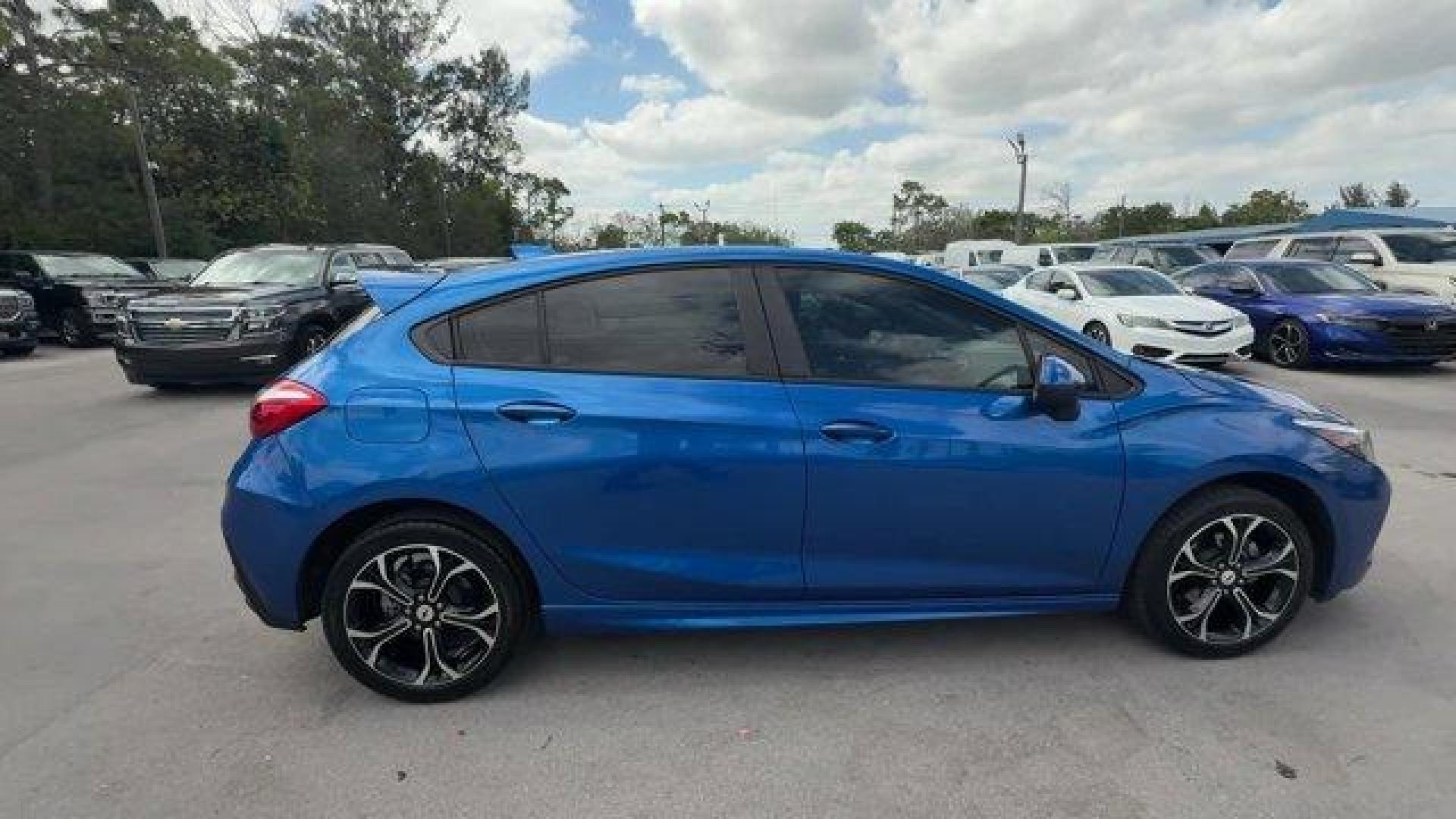 2019 Kinetic Blue Metallic /Jet Black Chevrolet Cruze (3G1BE6SM9KS) with an 4 1.4L engine, Automatic transmission, located at 27610 S Dixie Hwy, Homestead, FL, 33032, (305) 749-2348, 25.510241, -80.438301 - Delivers 38 Highway MPG and 28 City MPG! This Chevrolet Cruze delivers a Turbocharged Gas I4 1.4L/85 engine powering this Automatic transmission. TRANSMISSION, 6-SPEED AUTOMATIC (STD), SEATS, FRONT BUCKET WITH RECLINING SEATBACKS AND ADJUSTABLE HEAD RESTRAINTS (STD), LT PREFERRED EQUIPMENT GROUP inc - Photo#5