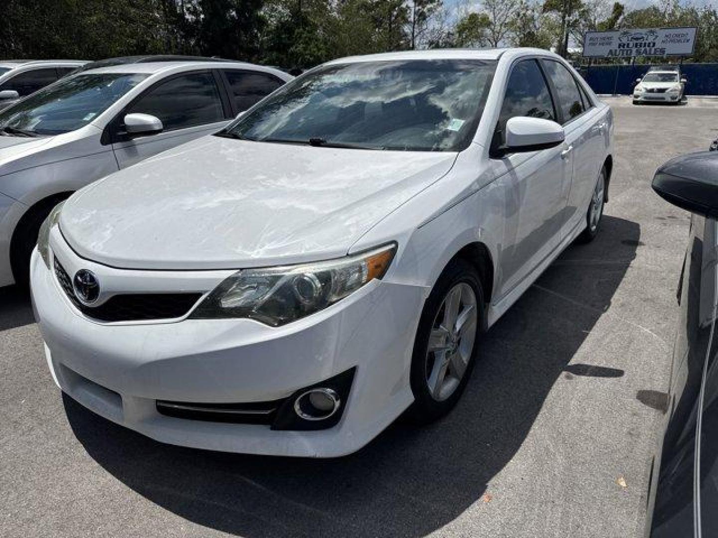 2014 White Toyota Camry (4T1BF1FK0EU) with an 4 2.5 L engine, Automatic transmission, located at 27610 S Dixie Hwy, Homestead, FL, 33032, (305) 749-2348, 25.510241, -80.438301 - KBB.com 10 Best Hybrid Cars Under $30,000. Only 120,921 Miles! Boasts 35 Highway MPG and 25 City MPG! This Toyota Camry delivers a Regular Unleaded I-4 2.5 L/152 engine powering this Automatic transmission. Window Grid Antenna, Valet Function, Trunk Rear Cargo Access.*This Toyota Camry Comes Equippe - Photo#0