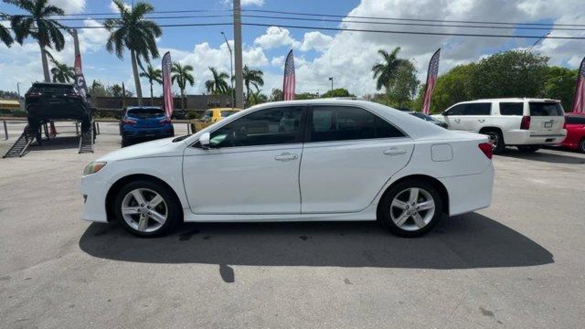 2014 White Toyota Camry (4T1BF1FK0EU) with an 4 2.5 L engine, Automatic transmission, located at 27610 S Dixie Hwy, Homestead, FL, 33032, (305) 749-2348, 25.510241, -80.438301 - KBB.com 10 Best Hybrid Cars Under $30,000. Only 120,921 Miles! Boasts 35 Highway MPG and 25 City MPG! This Toyota Camry delivers a Regular Unleaded I-4 2.5 L/152 engine powering this Automatic transmission. Window Grid Antenna, Valet Function, Trunk Rear Cargo Access.*This Toyota Camry Comes Equippe - Photo#1