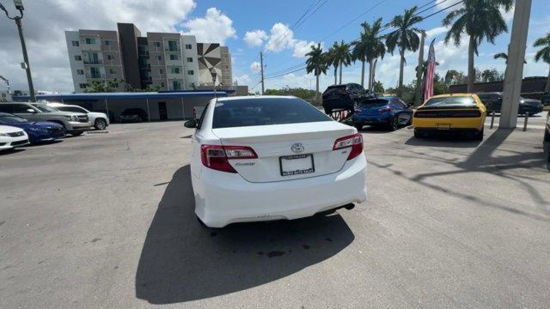 2014 White Toyota Camry (4T1BF1FK0EU) with an 4 2.5 L engine, Automatic transmission, located at 27610 S Dixie Hwy, Homestead, FL, 33032, (305) 749-2348, 25.510241, -80.438301 - KBB.com 10 Best Hybrid Cars Under $30,000. Only 120,921 Miles! Boasts 35 Highway MPG and 25 City MPG! This Toyota Camry delivers a Regular Unleaded I-4 2.5 L/152 engine powering this Automatic transmission. Window Grid Antenna, Valet Function, Trunk Rear Cargo Access.*This Toyota Camry Comes Equippe - Photo#3