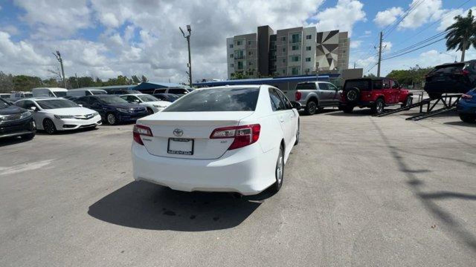 2014 White Toyota Camry (4T1BF1FK0EU) with an 4 2.5 L engine, Automatic transmission, located at 27610 S Dixie Hwy, Homestead, FL, 33032, (305) 749-2348, 25.510241, -80.438301 - KBB.com 10 Best Hybrid Cars Under $30,000. Only 120,921 Miles! Boasts 35 Highway MPG and 25 City MPG! This Toyota Camry delivers a Regular Unleaded I-4 2.5 L/152 engine powering this Automatic transmission. Window Grid Antenna, Valet Function, Trunk Rear Cargo Access.*This Toyota Camry Comes Equippe - Photo#4