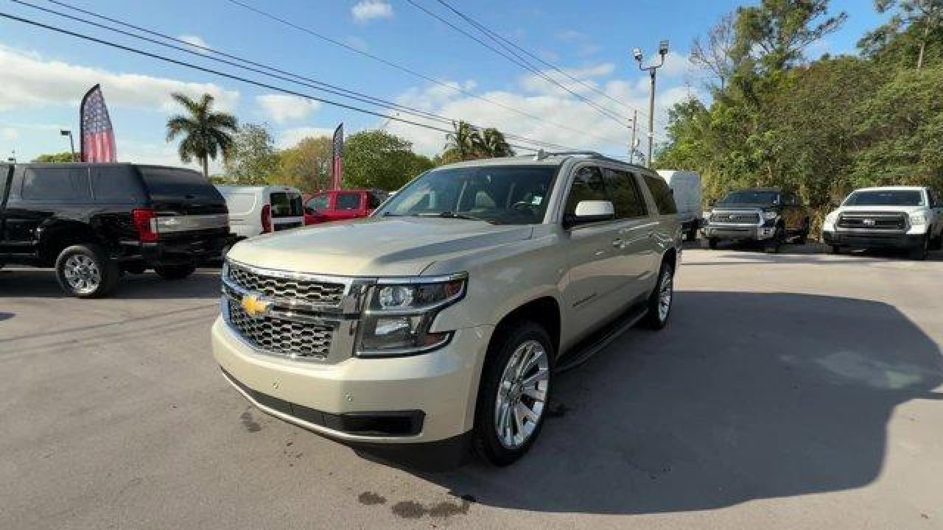 2015 Champagne Silver Metallic /Cocoa/Dune Chevrolet Suburban (1GNSCJKC9FR) with an 8 5.3L engine, Automatic transmission, located at 27610 S Dixie Hwy, Homestead, FL, 33032, (305) 749-2348, 25.510241, -80.438301 - KBB.com Best Resale Value Awards. Boasts 23 Highway MPG and 16 City MPG! This Chevrolet Suburban boasts a Gas/Ethanol V8 5.3L/ engine powering this Automatic transmission. WHEELS, 22 X 9 STEEL, INTERIM, TRANSMISSION, 6-SPEED AUTOMATIC, ELECTRONICALLY CONTROLLED with overdrive and tow/haul mode (STD) - Photo#0