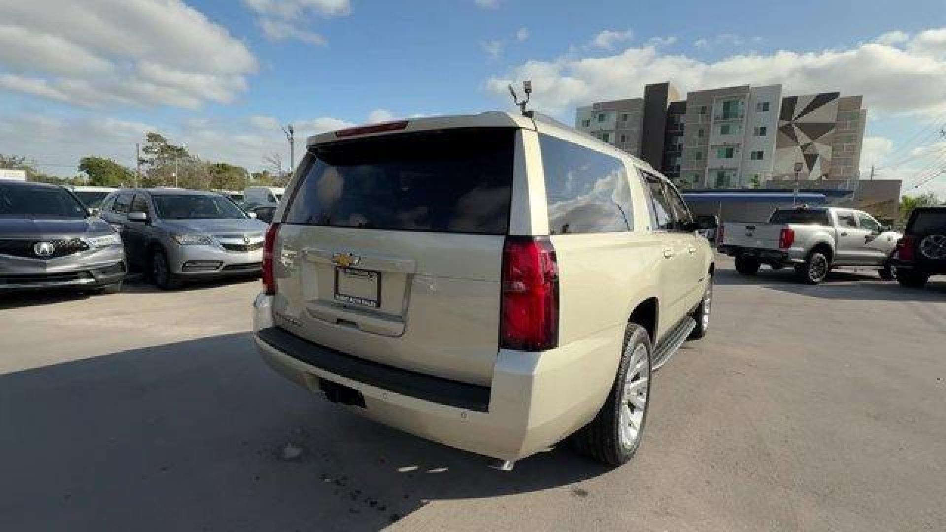 2015 Champagne Silver Metallic /Cocoa/Dune Chevrolet Suburban (1GNSCJKC9FR) with an 8 5.3L engine, Automatic transmission, located at 27610 S Dixie Hwy, Homestead, FL, 33032, (305) 749-2348, 25.510241, -80.438301 - KBB.com Best Resale Value Awards. Boasts 23 Highway MPG and 16 City MPG! This Chevrolet Suburban boasts a Gas/Ethanol V8 5.3L/ engine powering this Automatic transmission. WHEELS, 22 X 9 STEEL, INTERIM, TRANSMISSION, 6-SPEED AUTOMATIC, ELECTRONICALLY CONTROLLED with overdrive and tow/haul mode (STD) - Photo#4